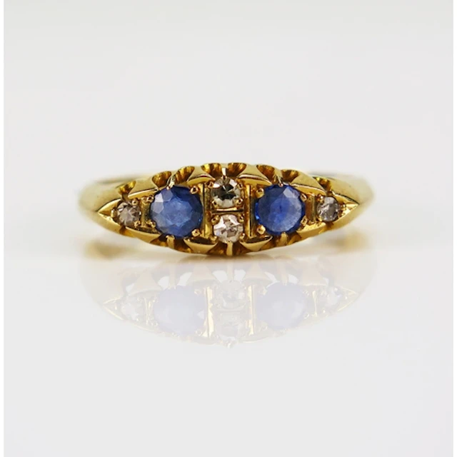 An antique sapphire and old cut diamond ring in an 18ct yell...