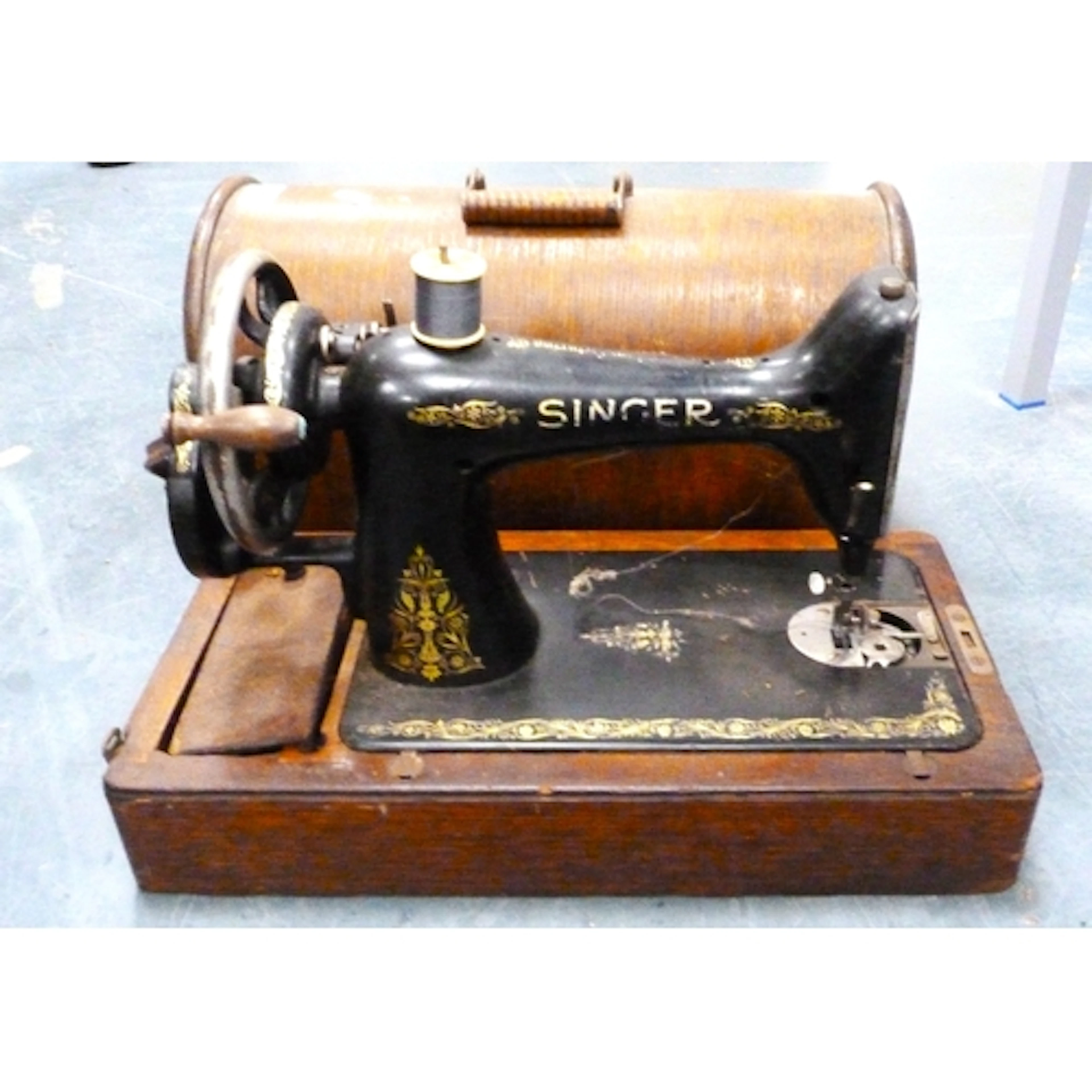 Singer sewing machine in fitted case.