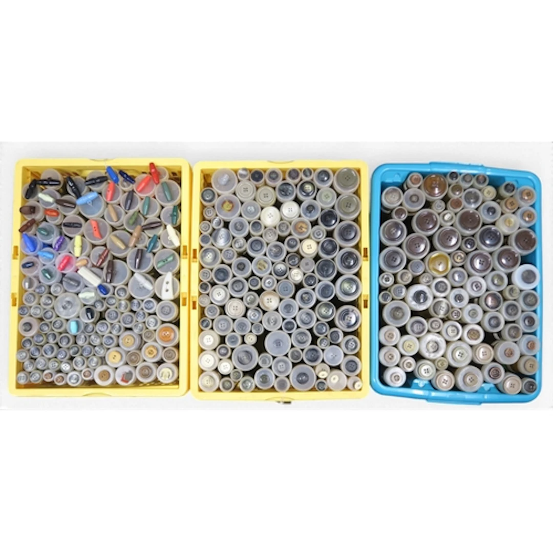 A large quantity of flat, shank, and toggle buttons to inclu...