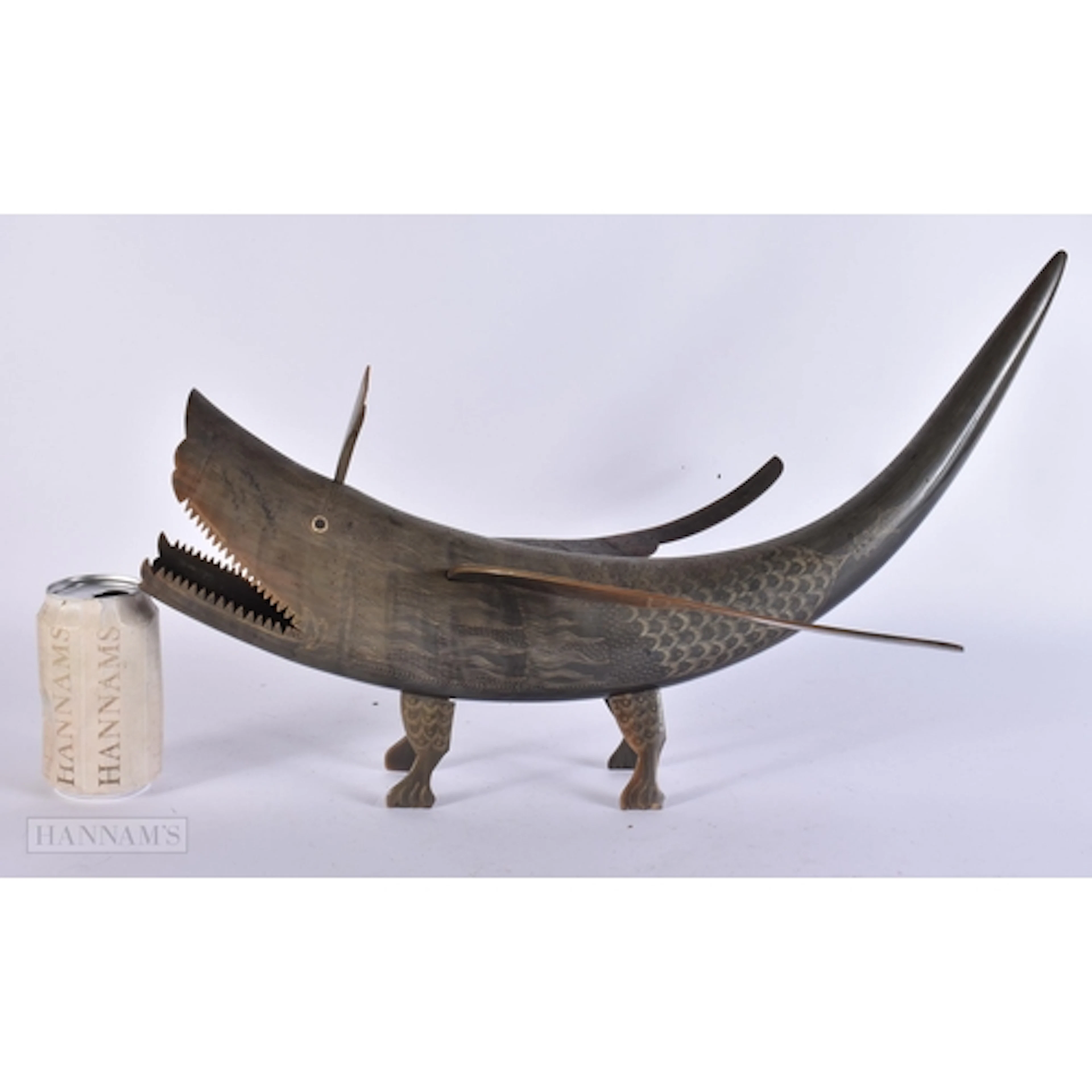 A LARGE MIDDLE EASTERN SCRIMSHAW HORN BEAST. 48 cm x 32 cm.