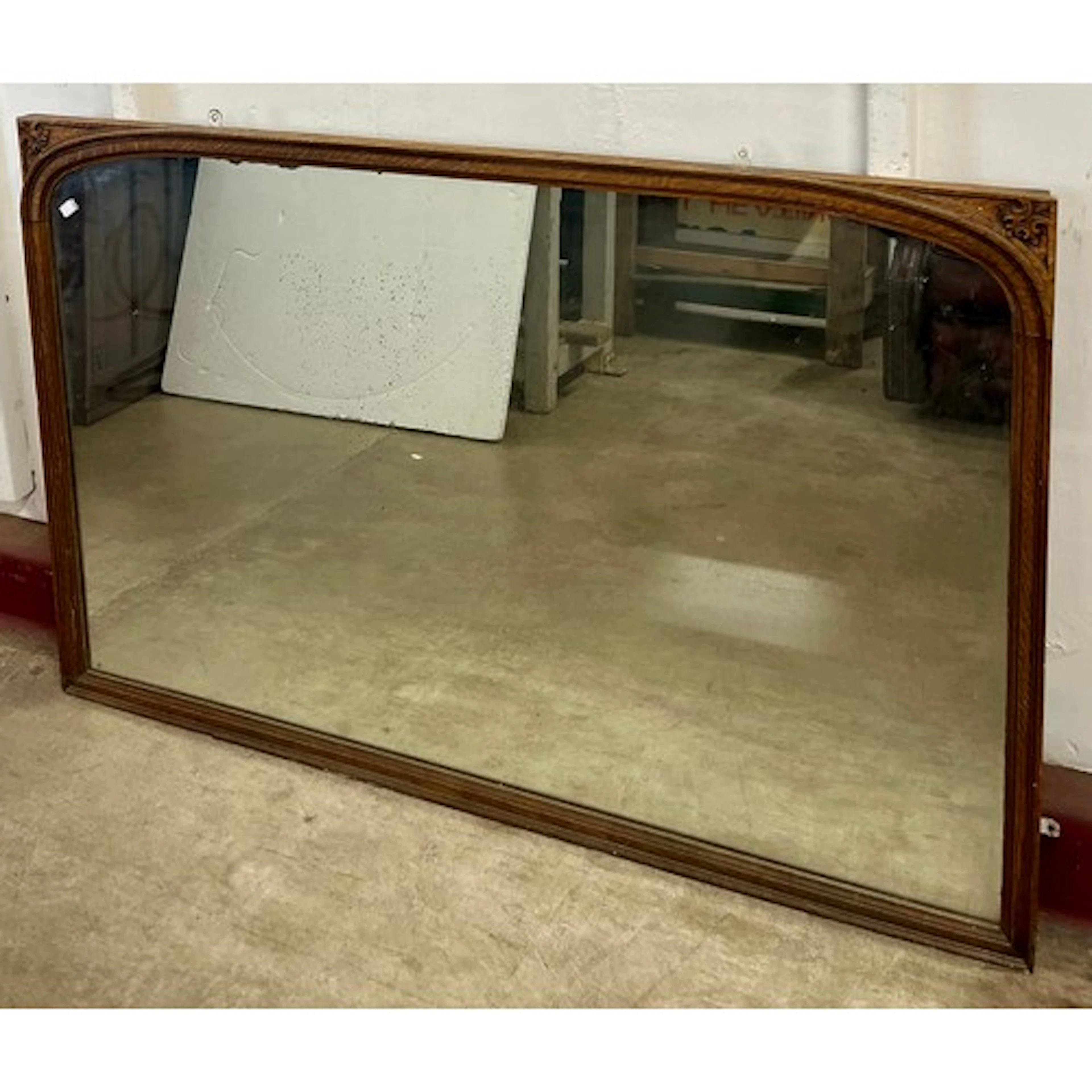 An Edward VII oak overmantel mirror