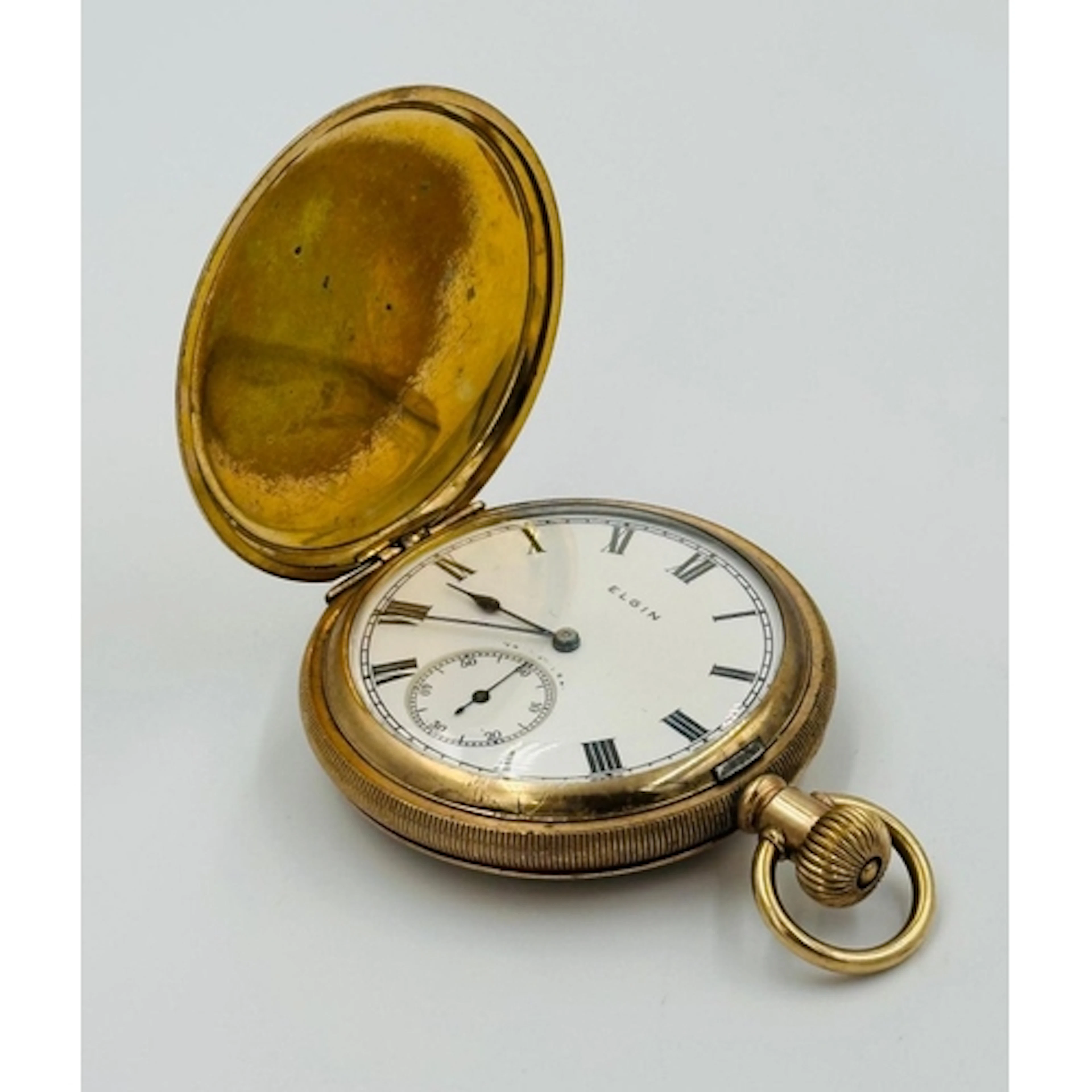 A Brass Elgin hunter pocket watch Keystone USA