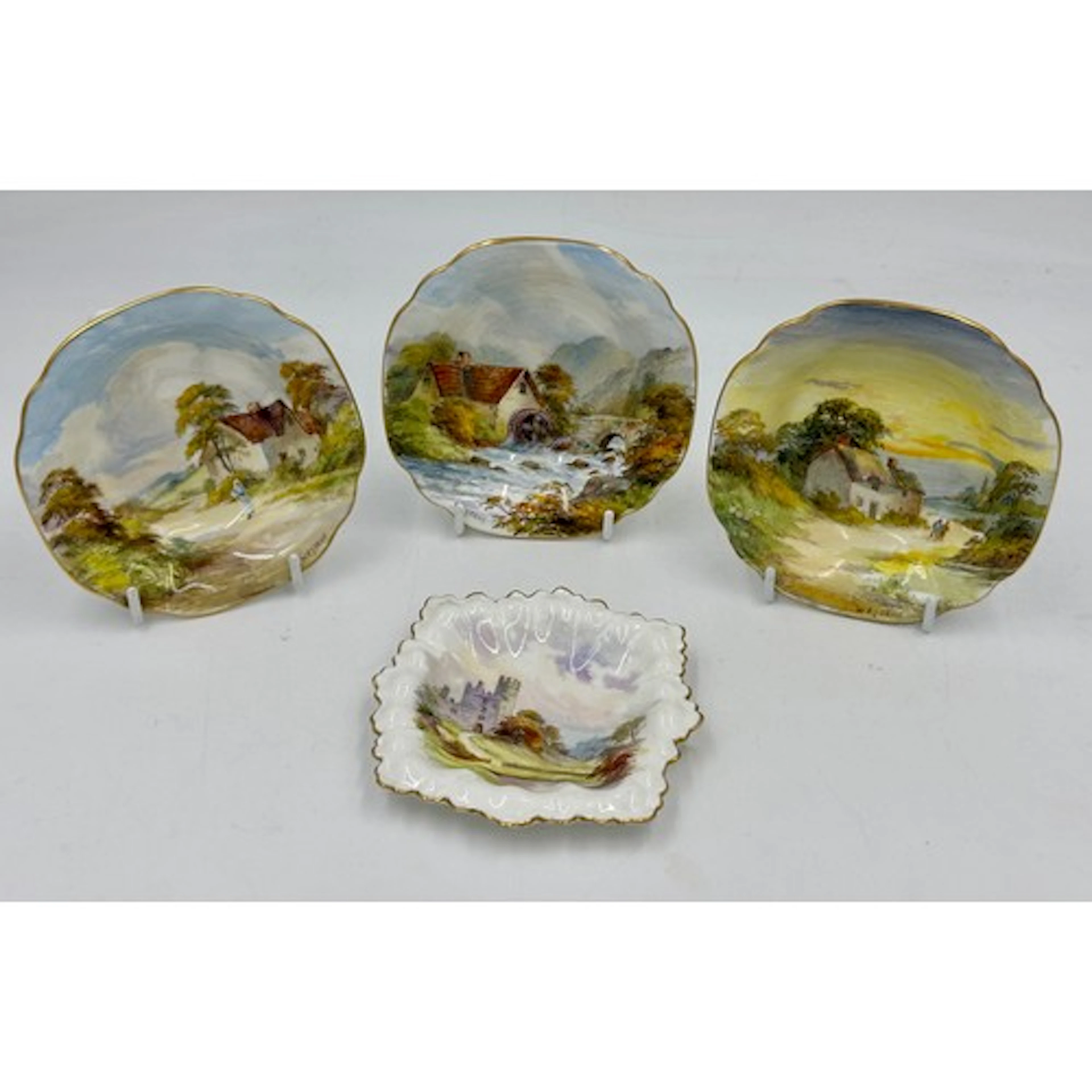 A collection of Royal Crown Derby, hand painted with rural s...