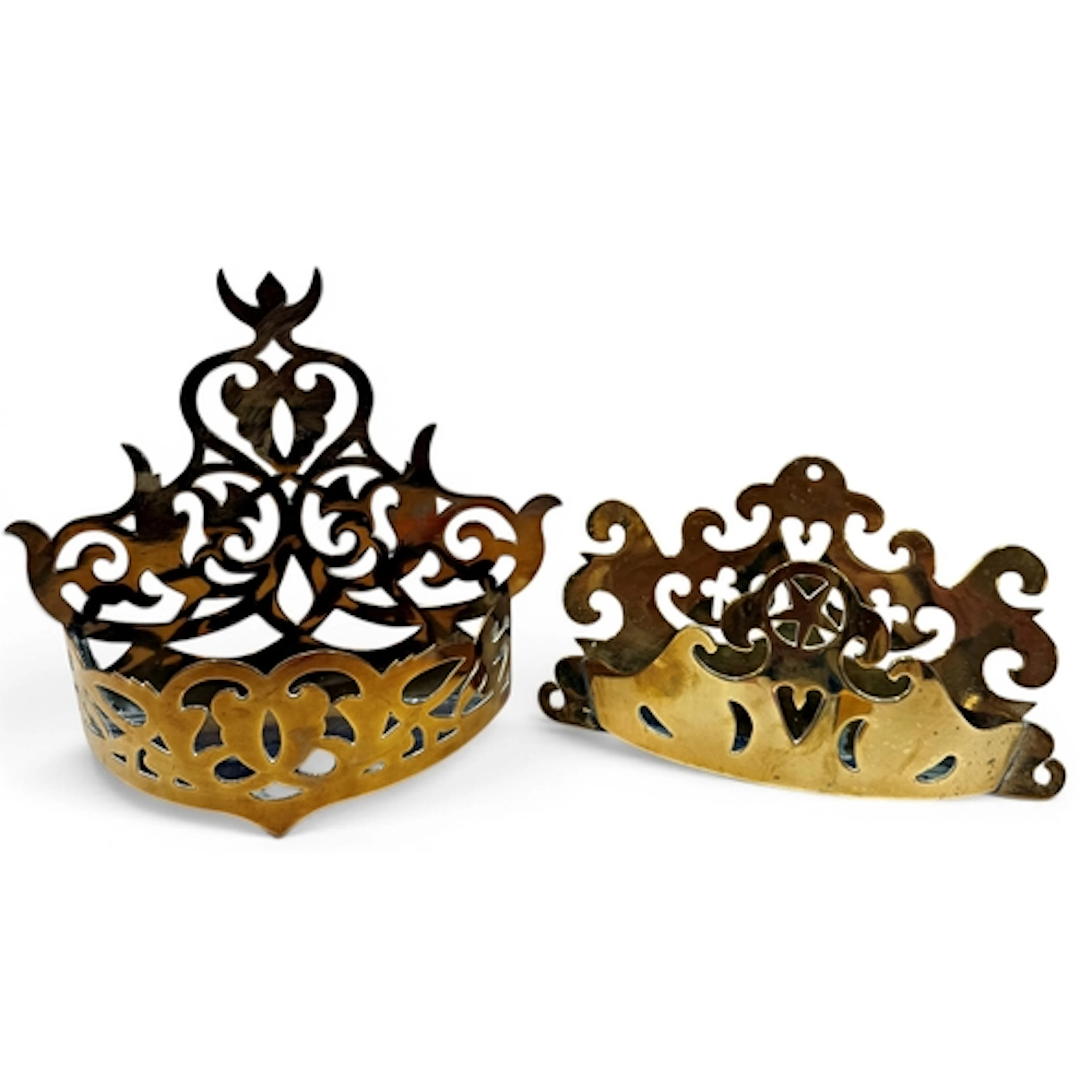 Two 19th century folk art pierced brass wall pockets, the la...