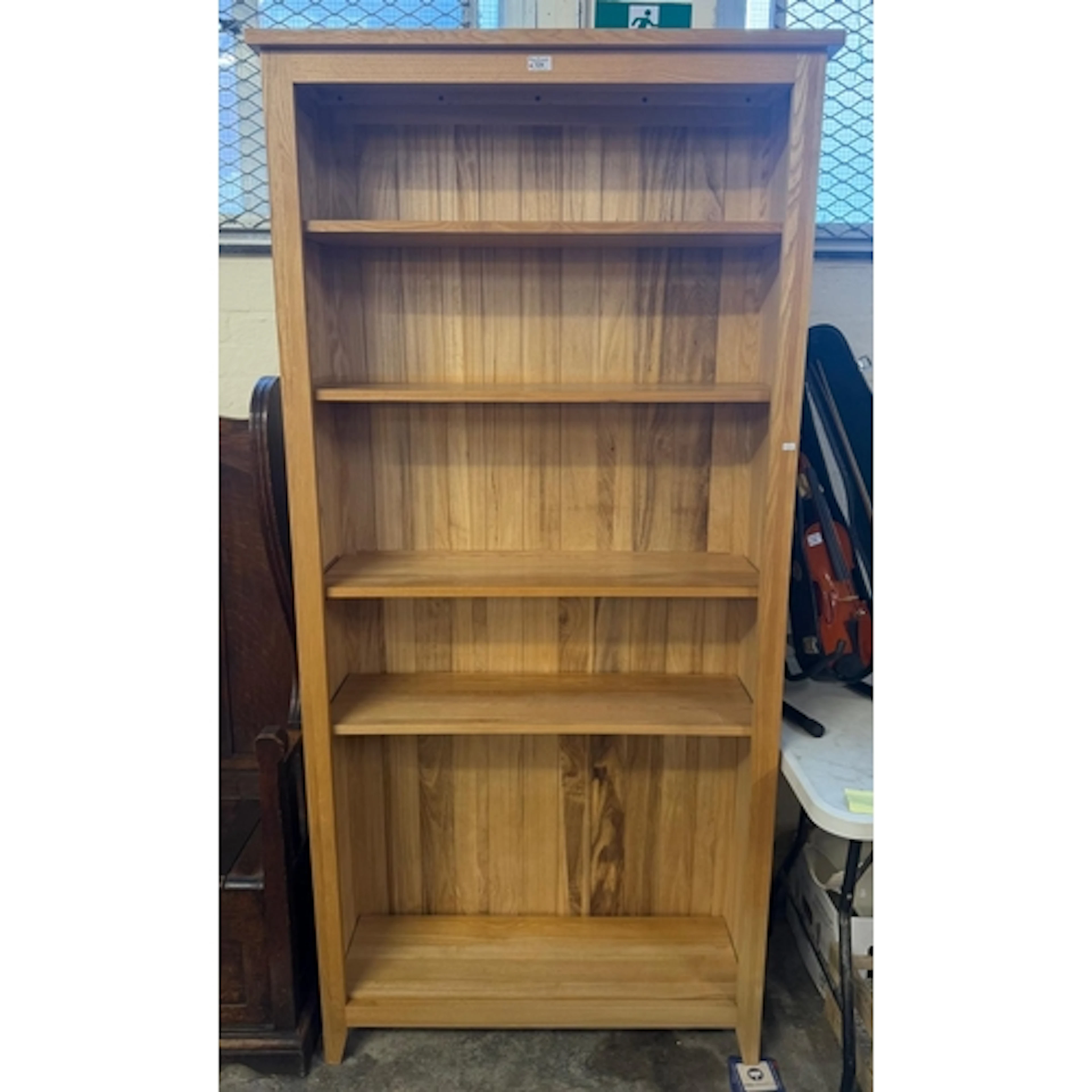 Modern pale oak free standing bookcase with adjustable shelv...