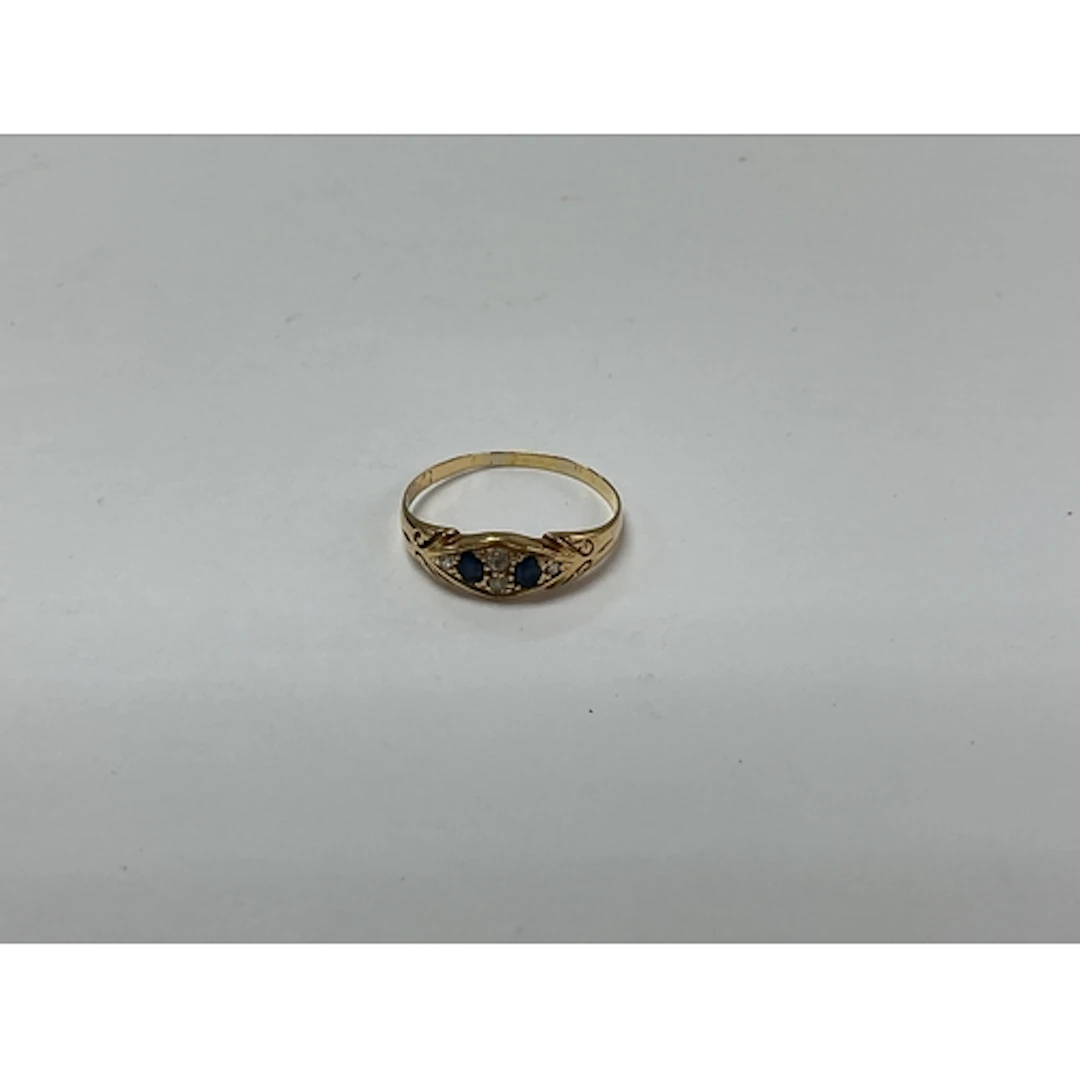An 18ct gold ring set with two sapphires. Approx size S 2.27...