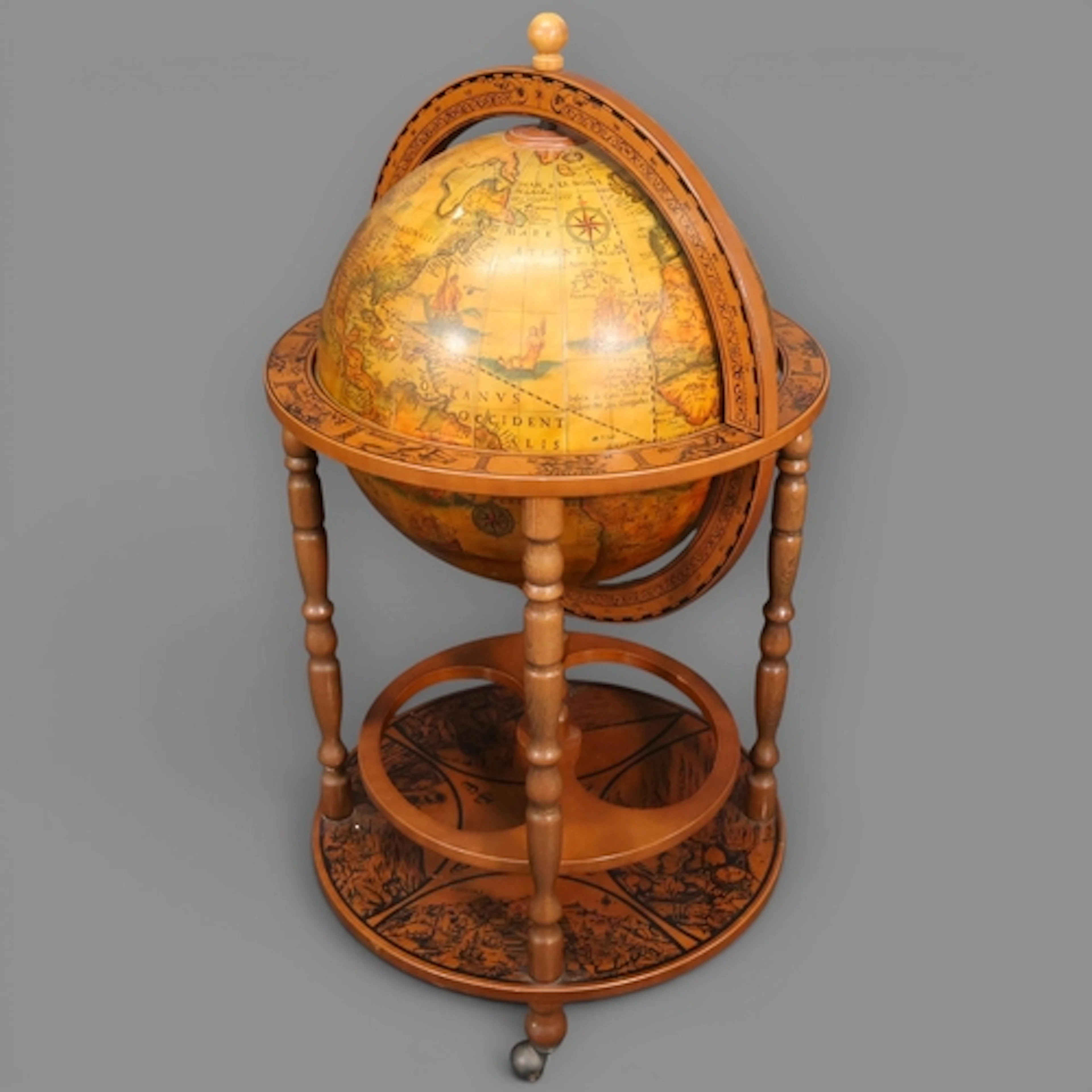 A Vintage Italian style terrestrial globe drinks trolley on ...