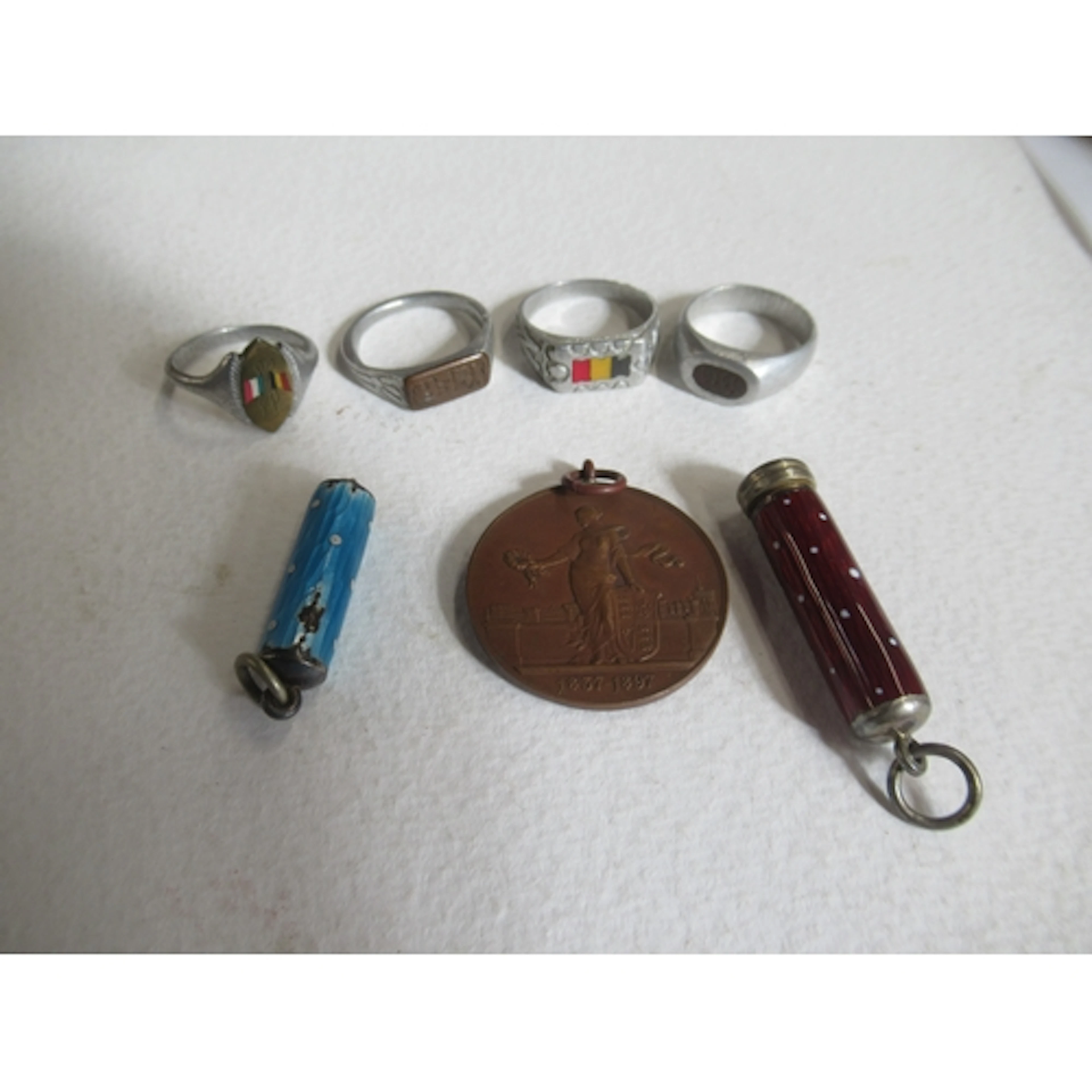 Four WW1 trench art finger rings, two inscribed YSER, the ot...