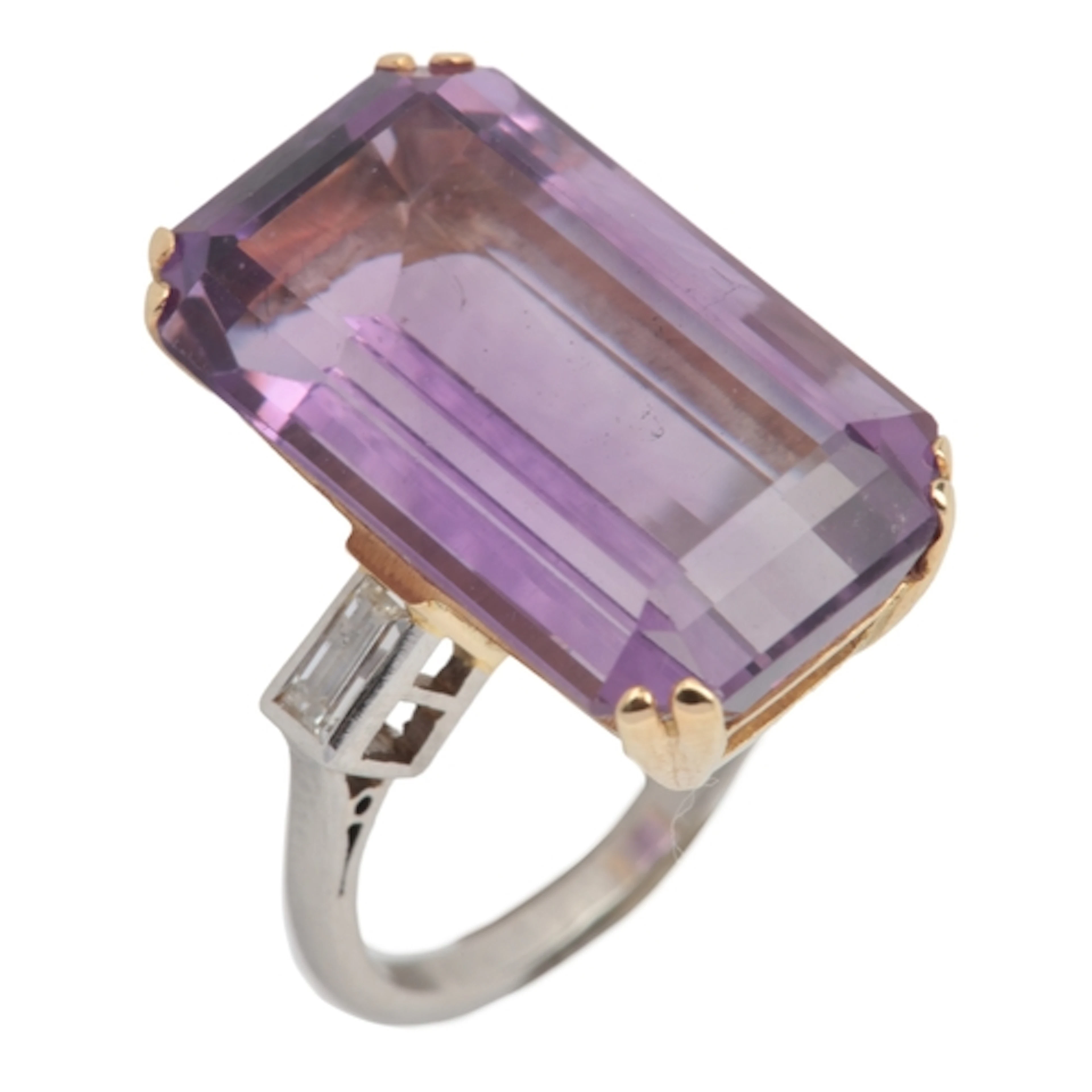 An amethyst and diamond ring, claw-set with a step-cut ameth...