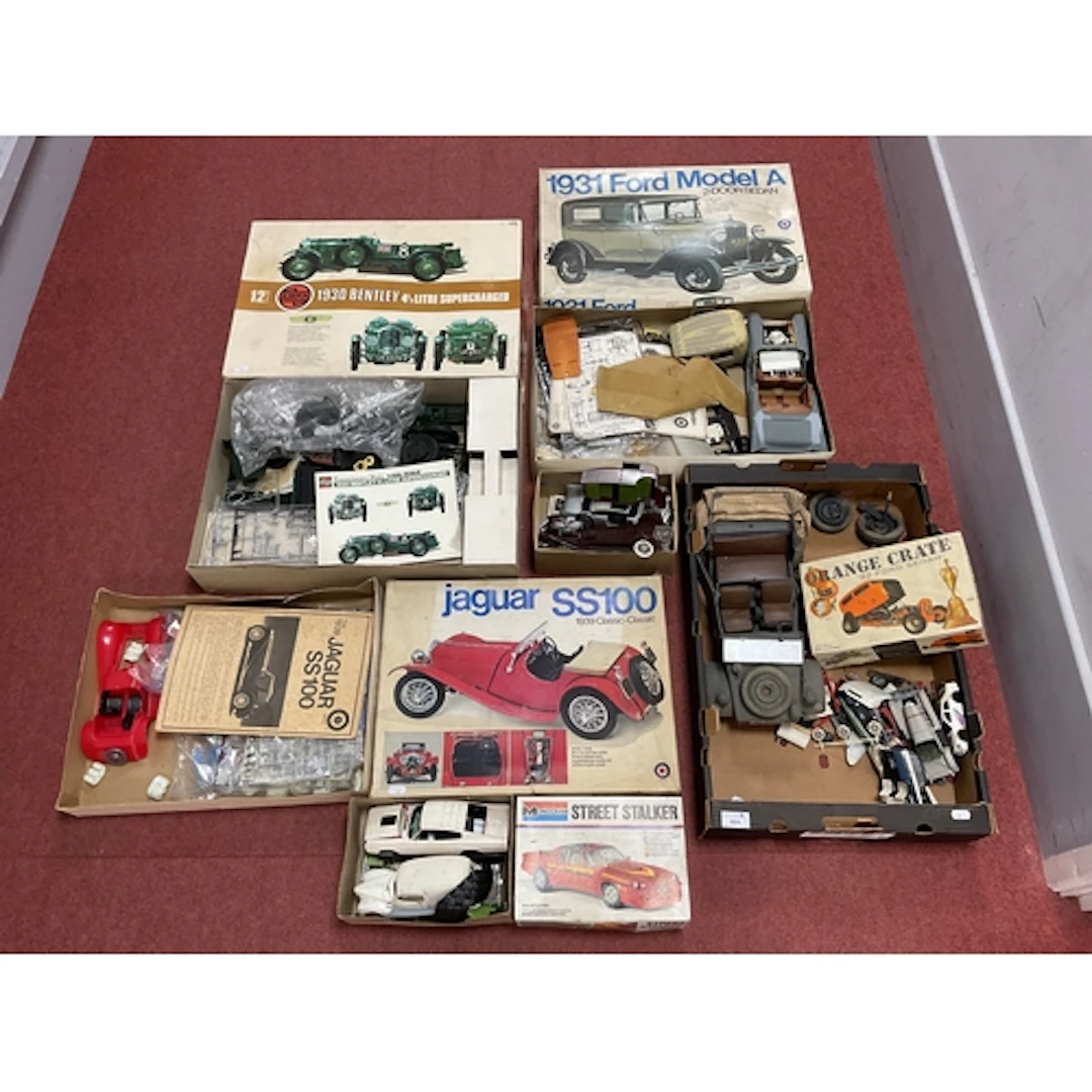 A quantity of started and partially constructed plastic mode...