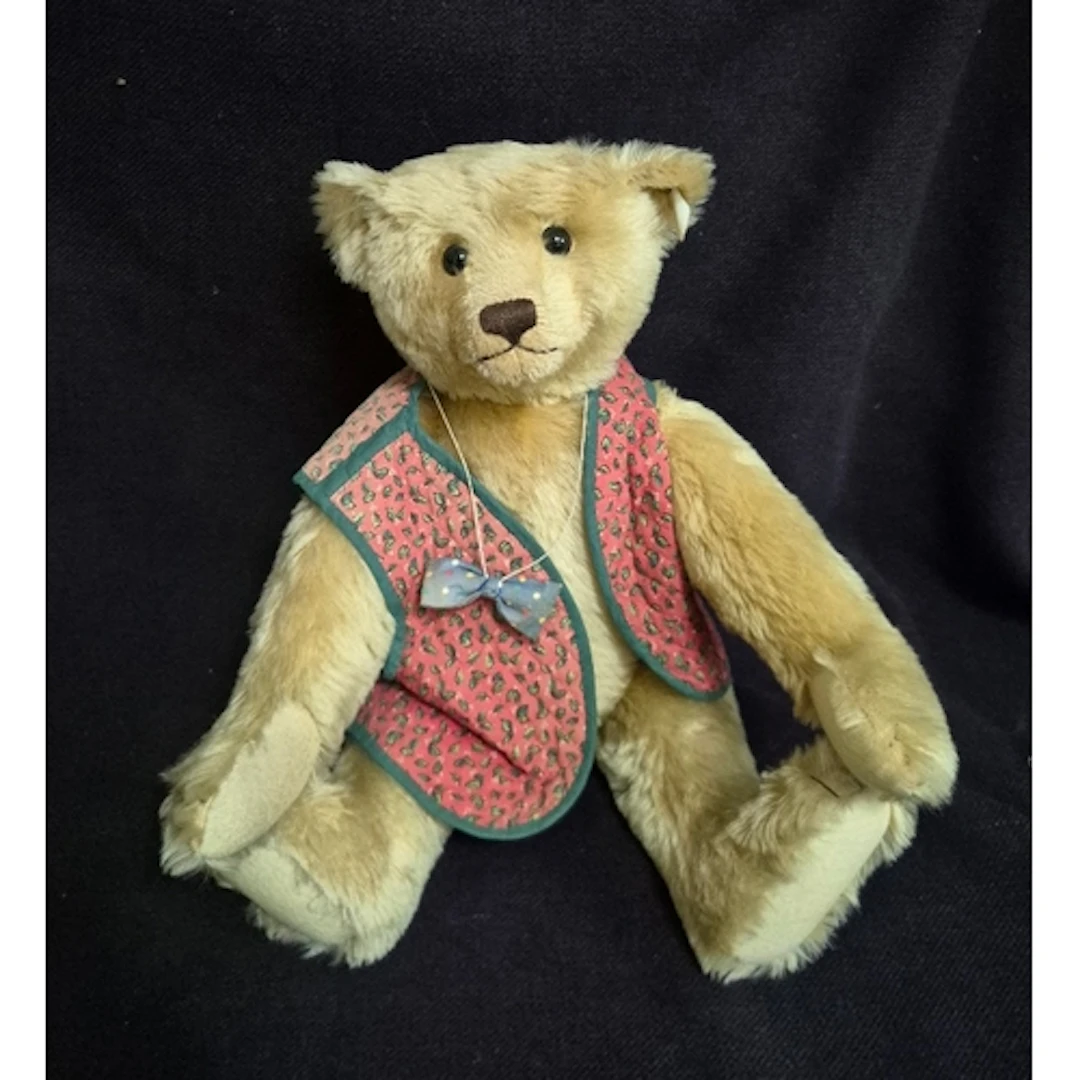 A steiff teddy bear with ear tag & white label, no product n...