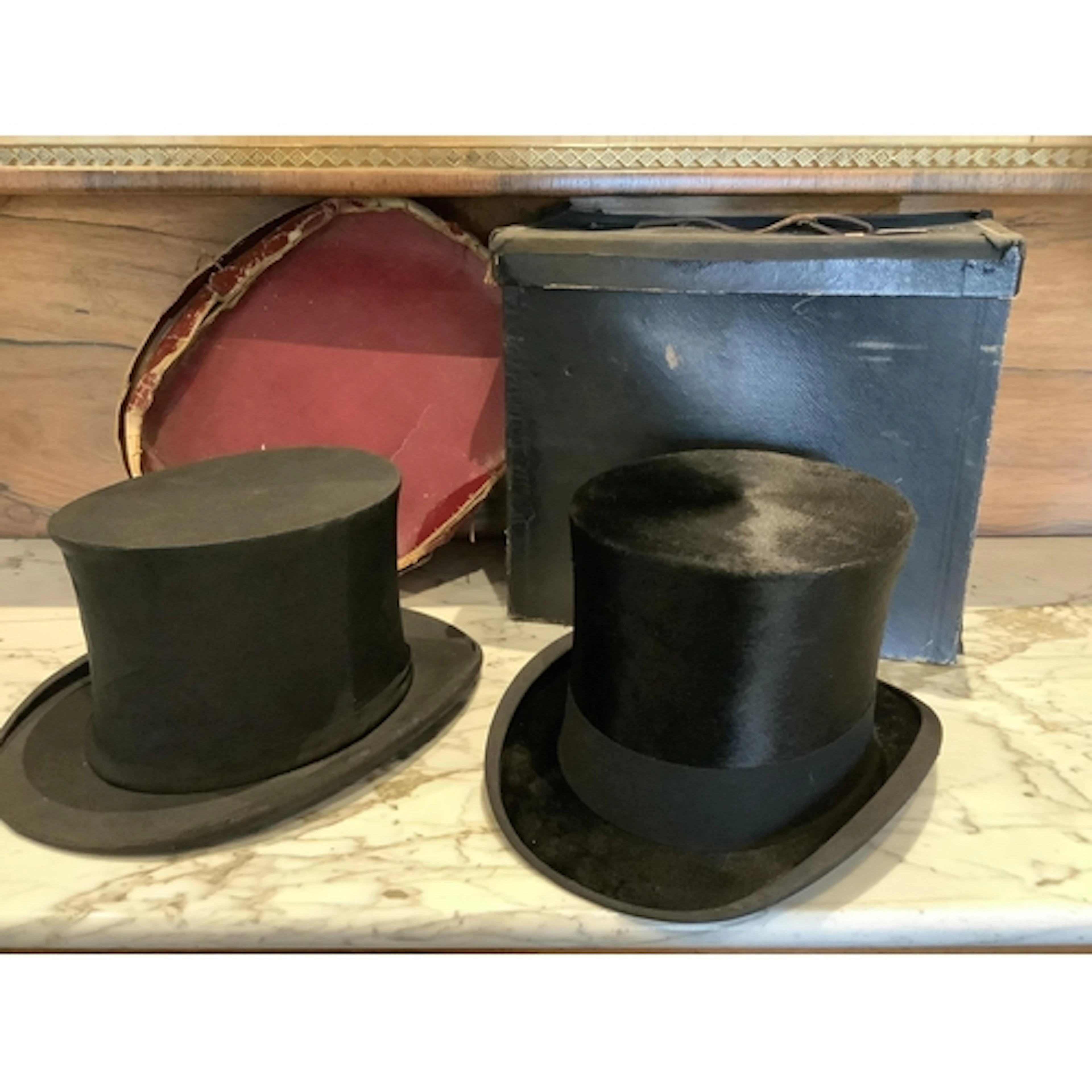 An early 20th century gentleman's collapsible black silk top...