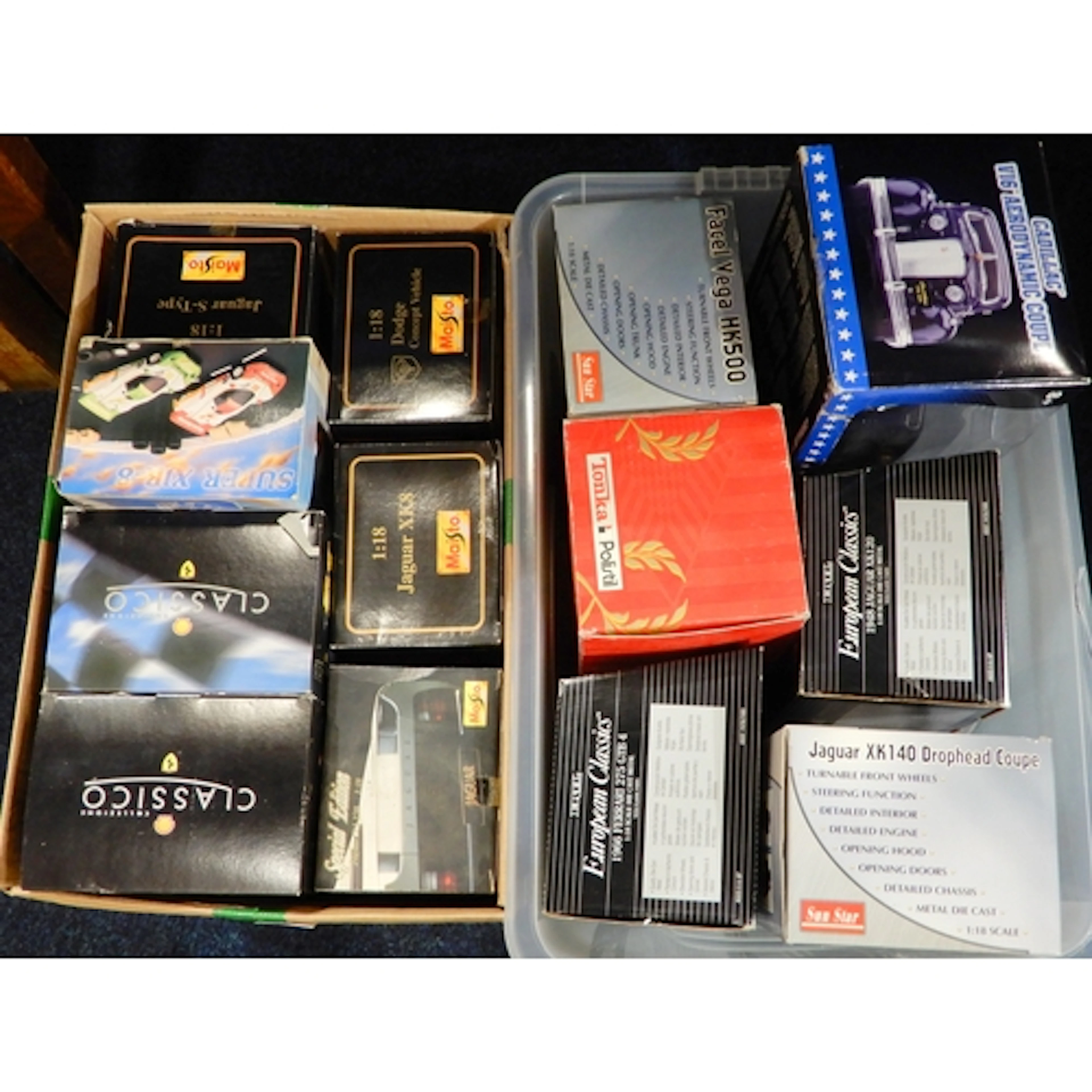 A collection of boxed diecast model vehicles, generally 1:18...