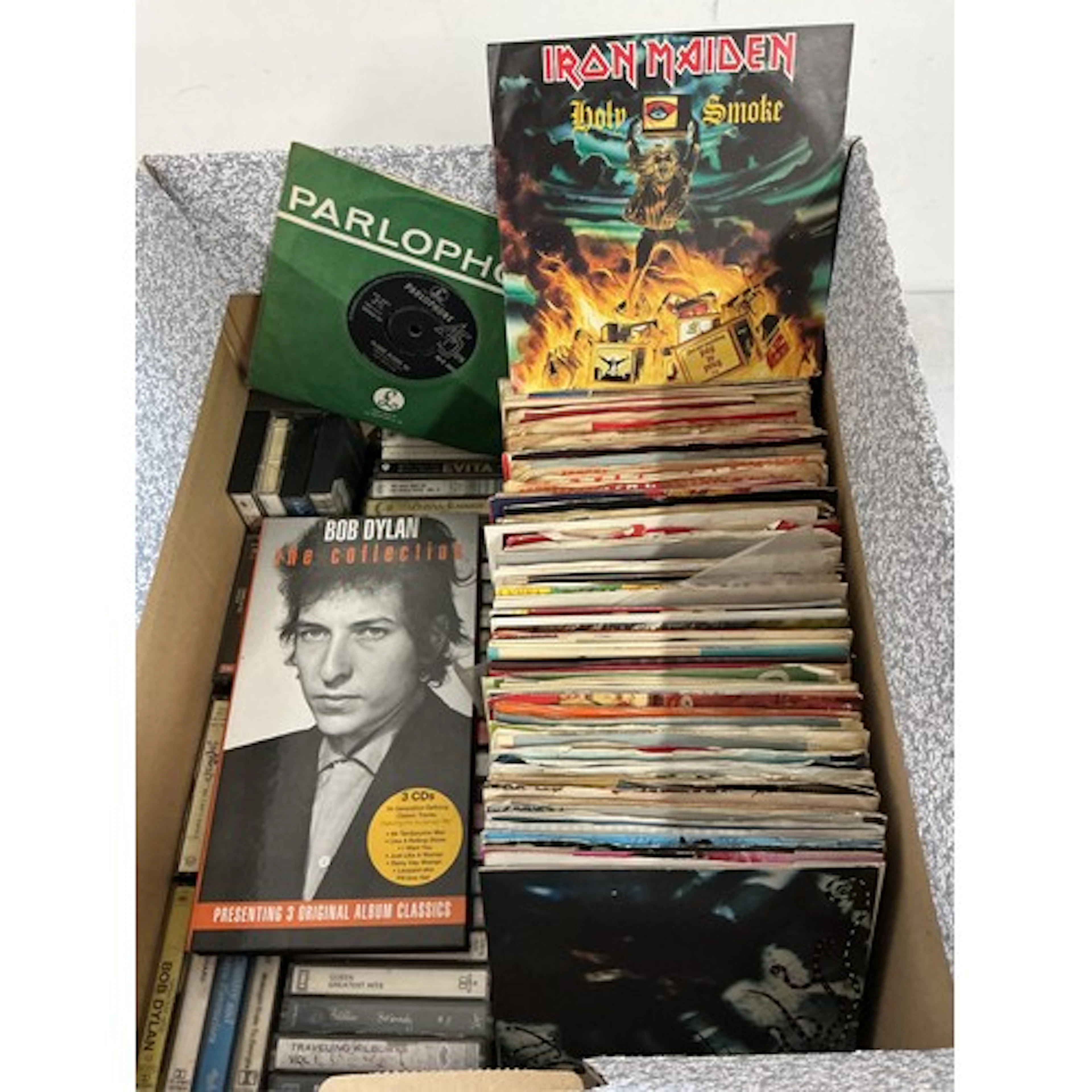 A collection of 7” singles, EPs and cassettes by various art...