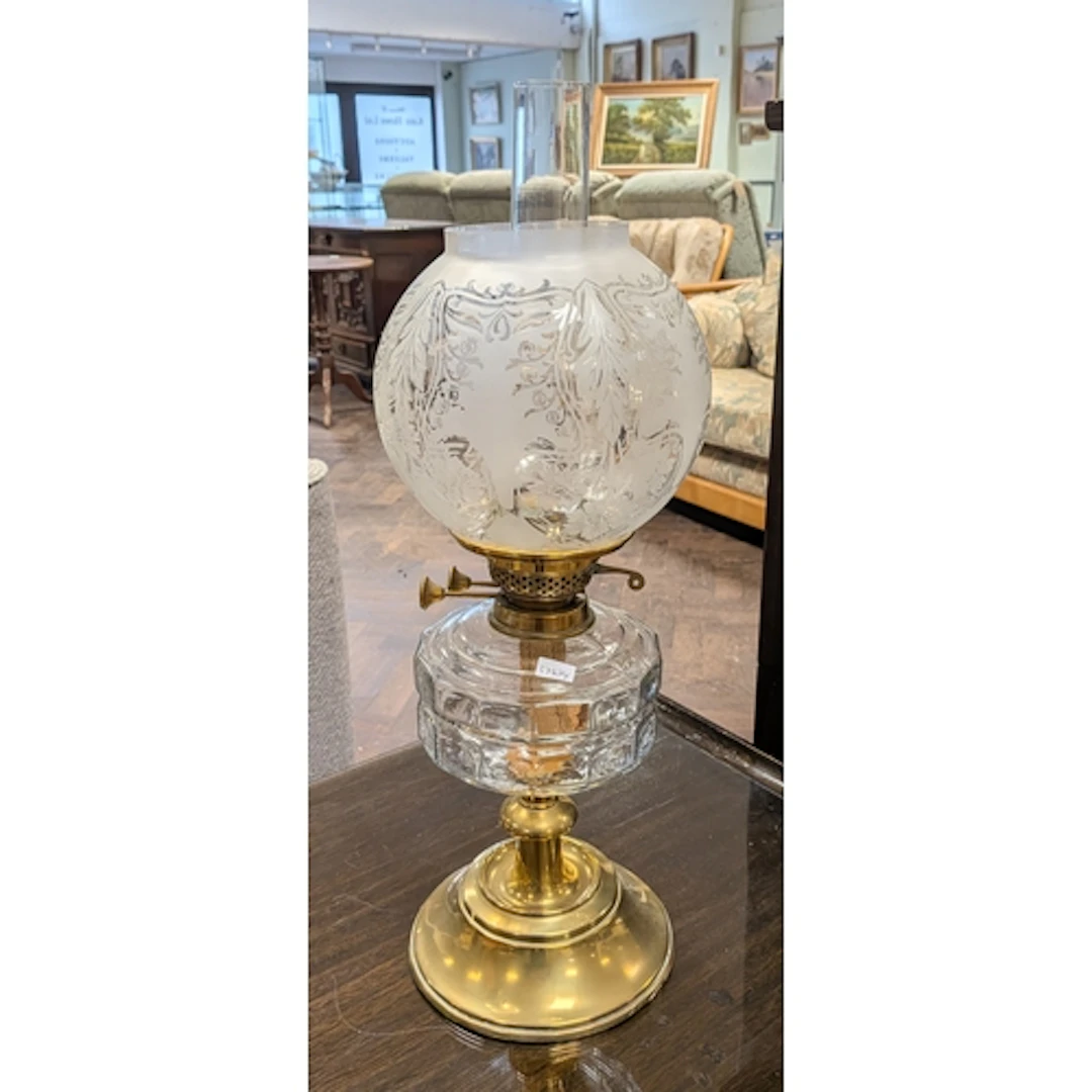 A Victorian brass oil lamp with brass bowl and shade