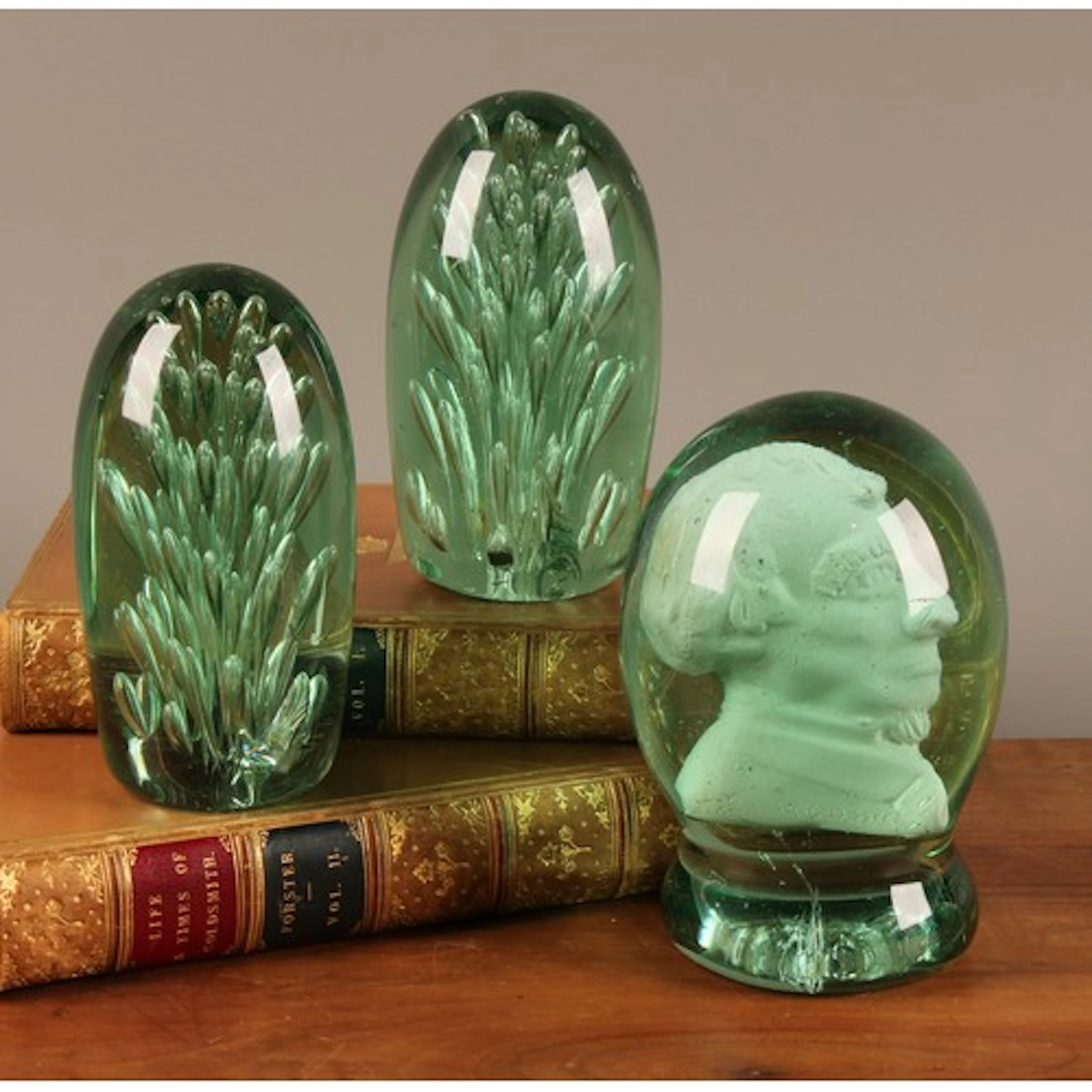 A Victorian green glass ovoid dump, portrait bust inclusion ...