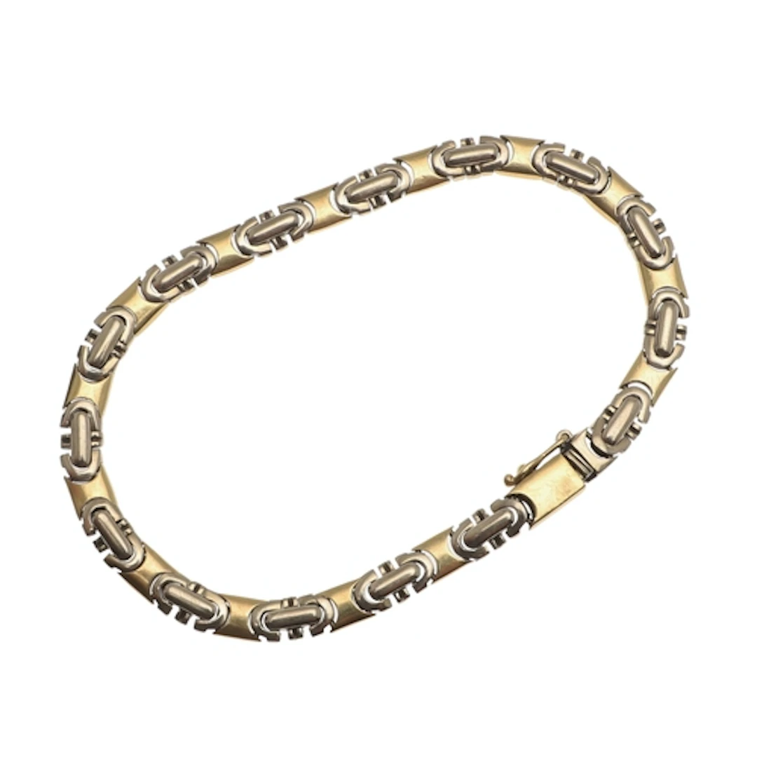 AN 18CT TWO COLOUR GOLD BRACELET. of geometric design, 20.5c...