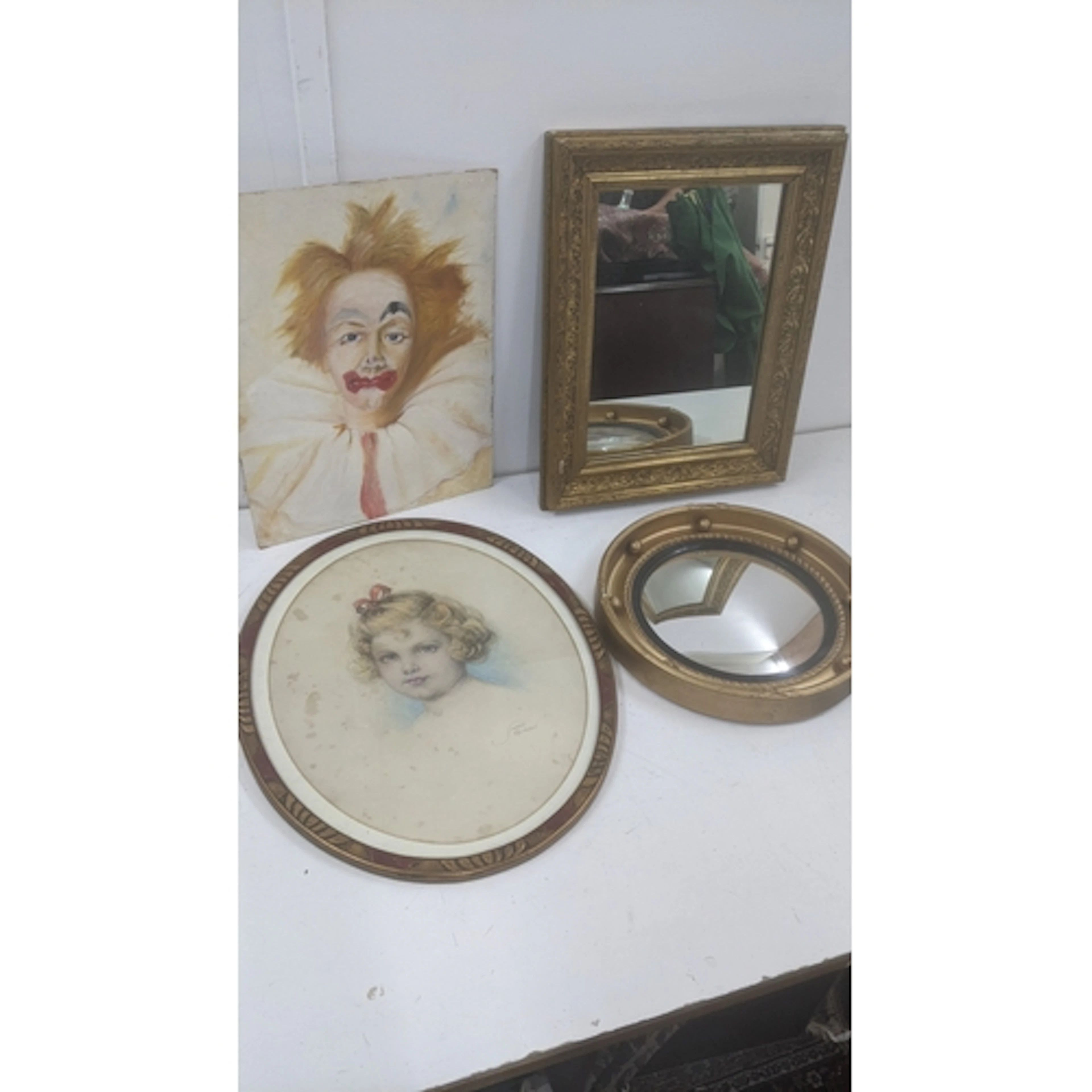 A Renaissance style mid century circular mirror, an oval por...