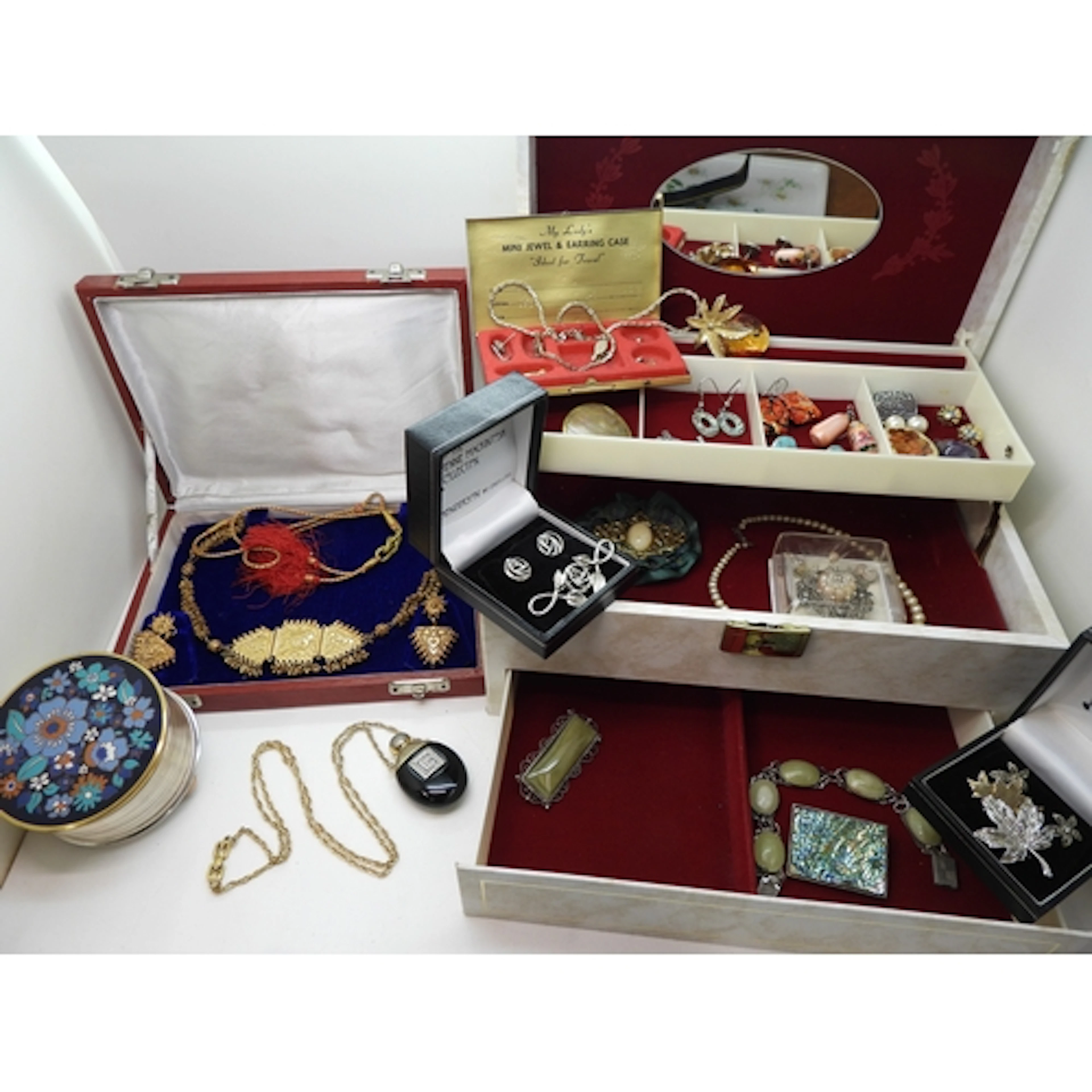 A jewellery box to include a musical compact, a boxed Indian...