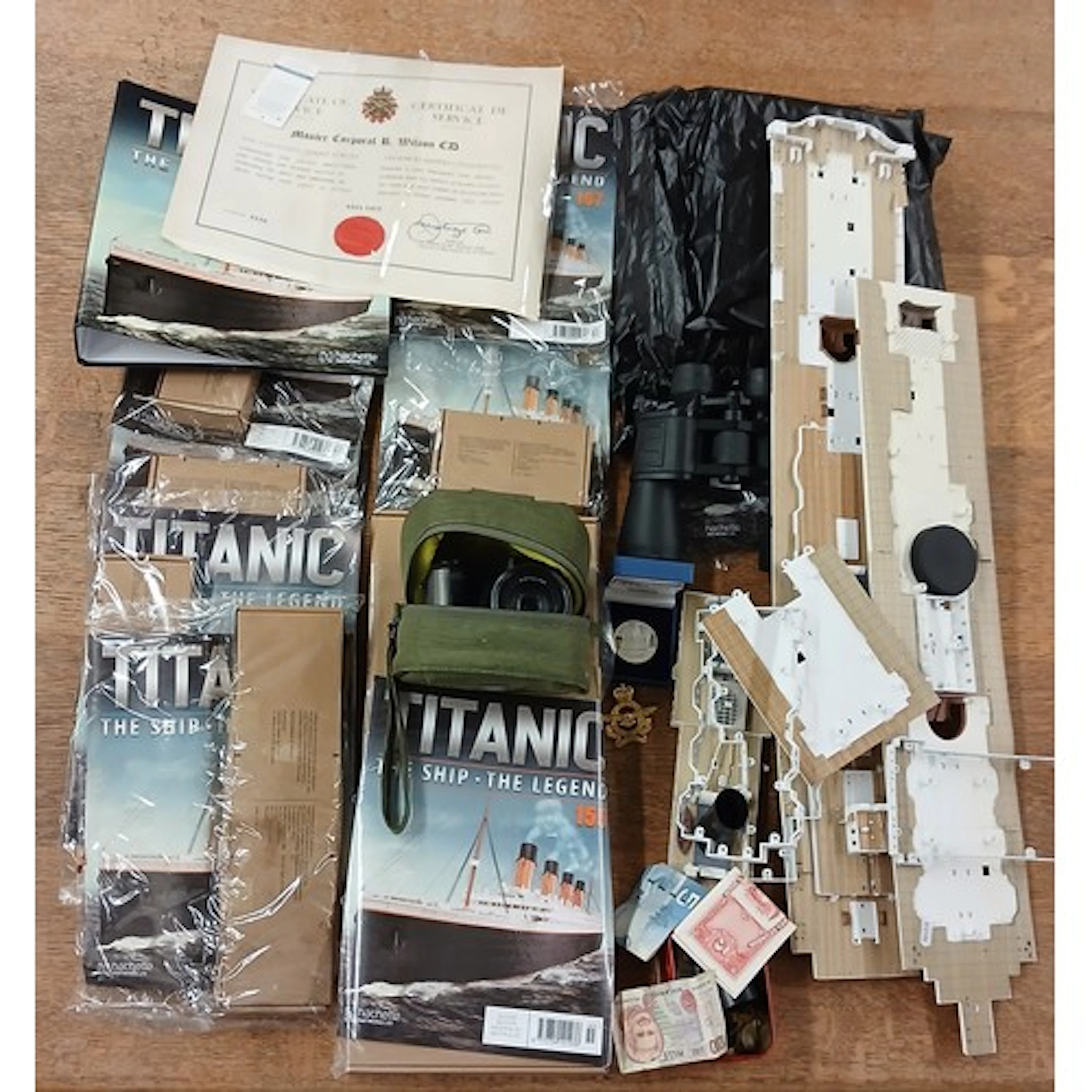 Box of assorted Titanic model boats with cameras, foreign cu...