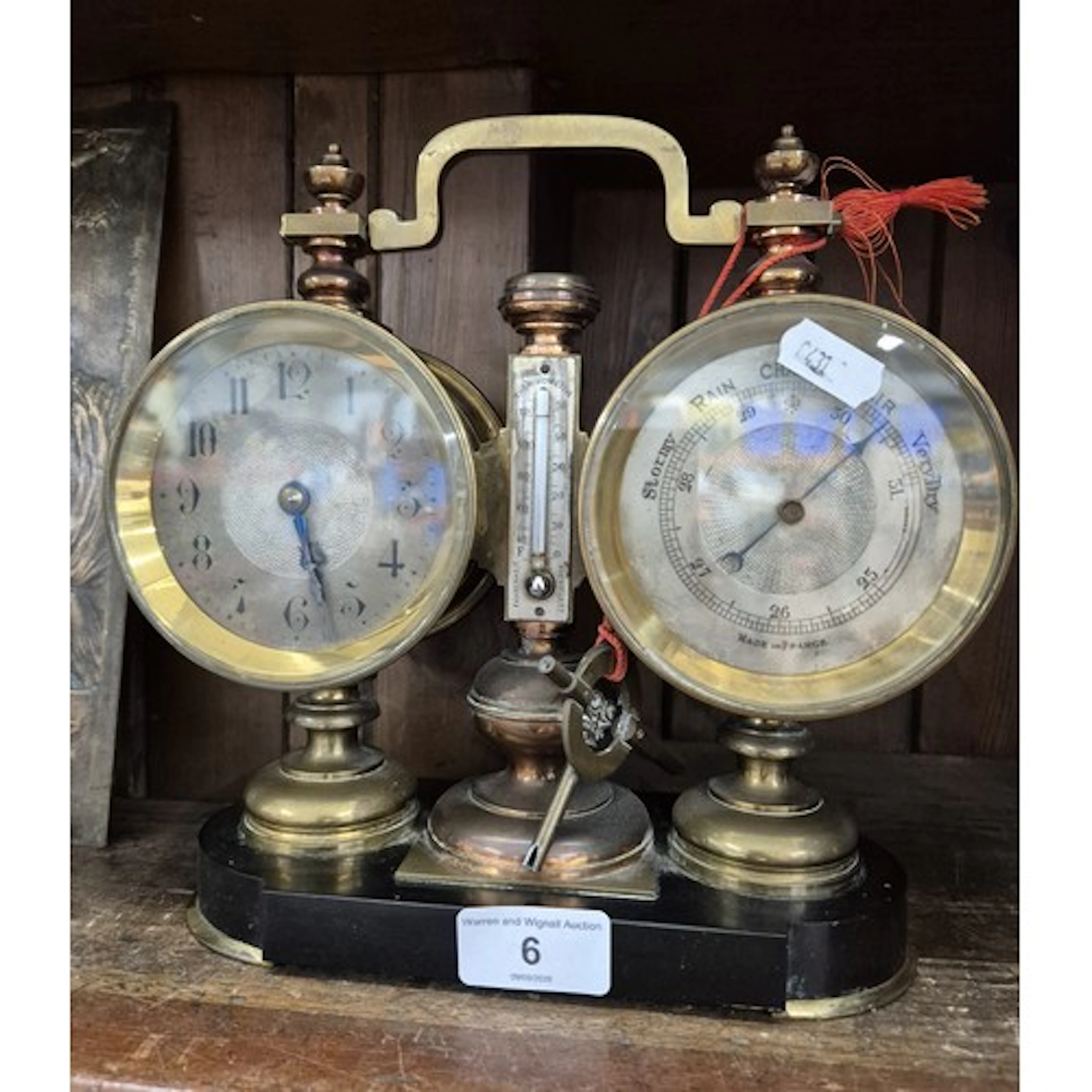 An antique French desk or mantle weather station featuring a...