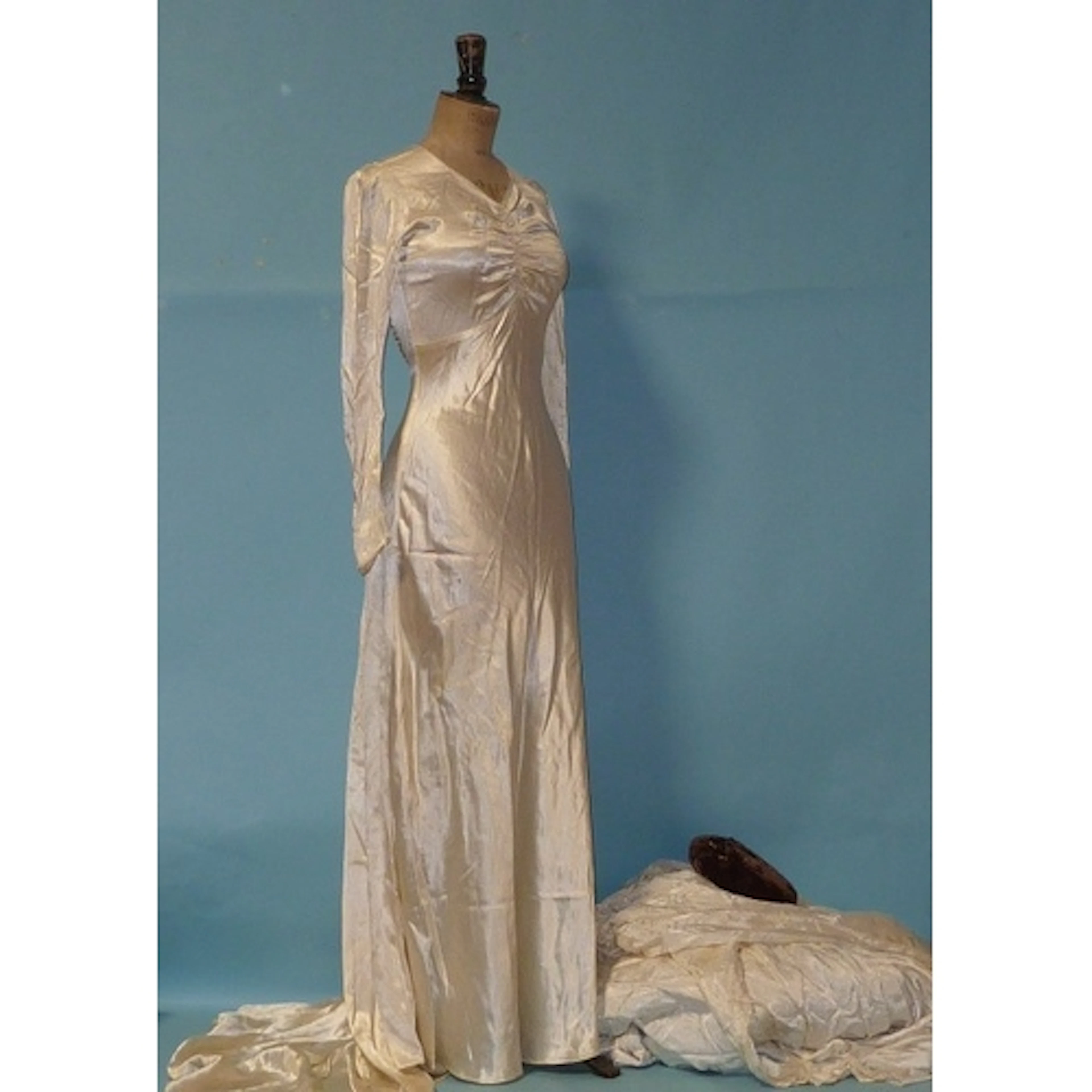 A Norman Young wedding dress, four other vintage (1930's and...