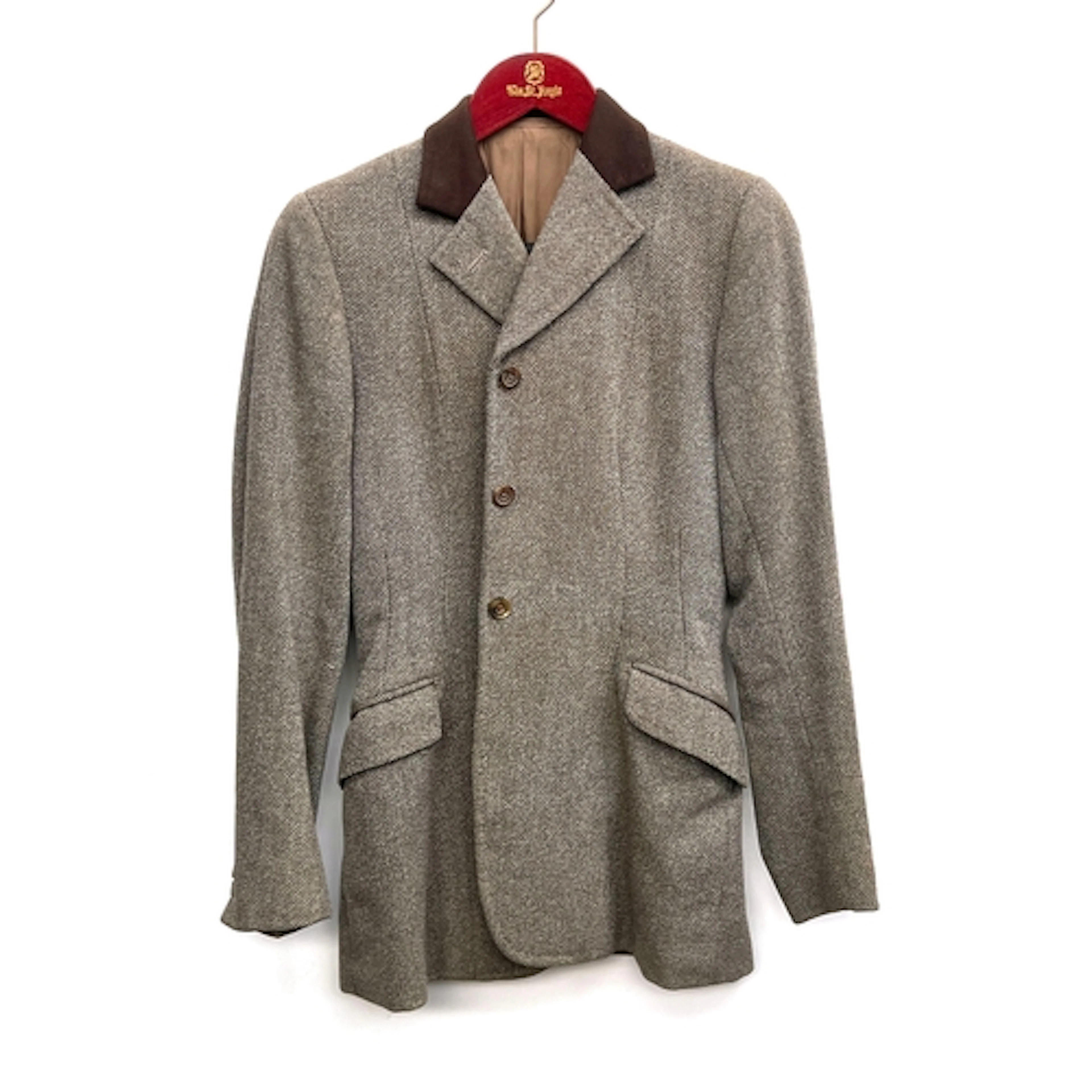 A ladies hacking jacket, with brown felt collar, tailored by...