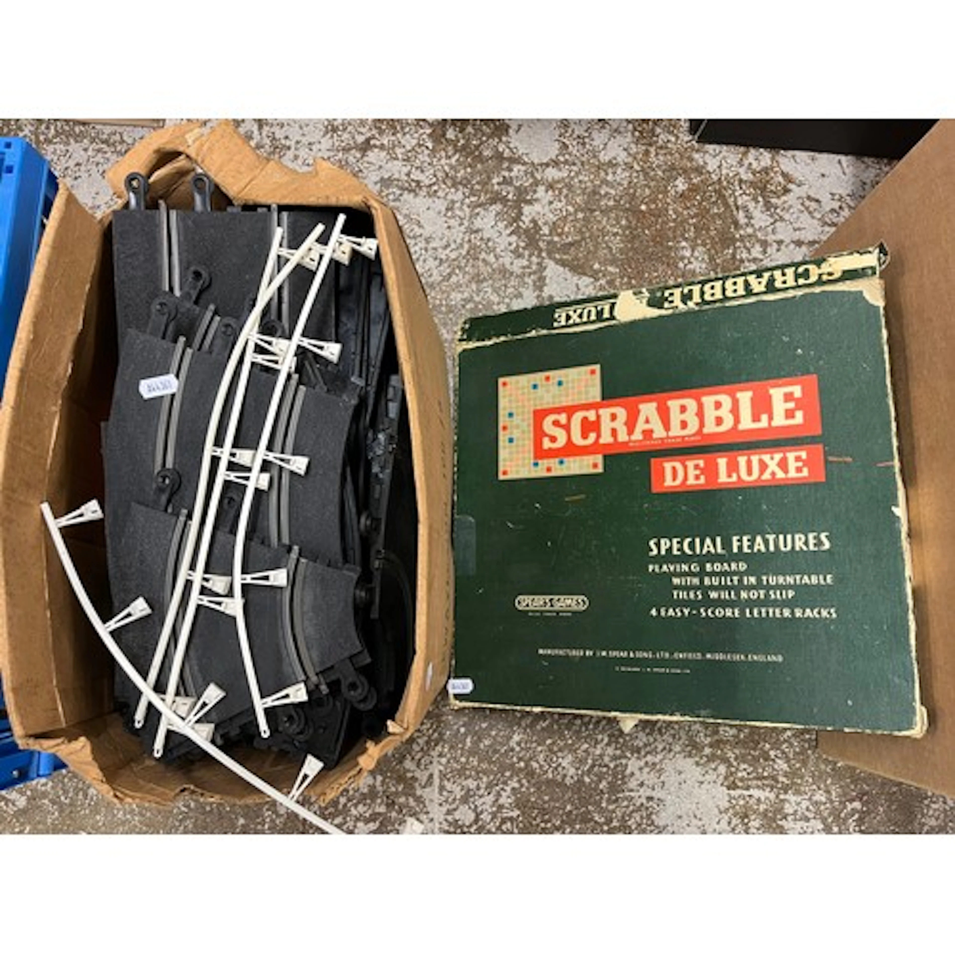 Collection of Scalextric tracks, with Scrabble