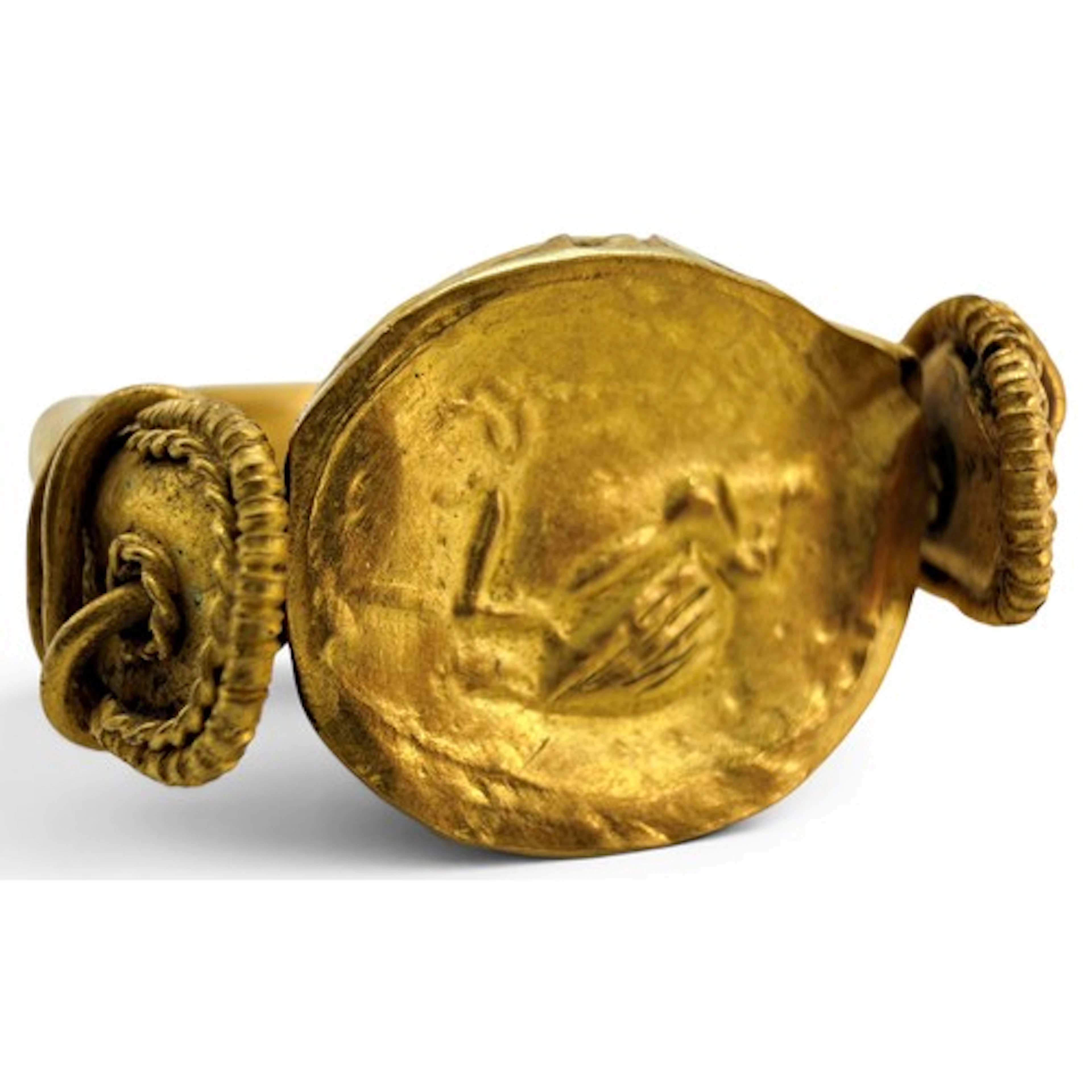 An ancient gold scarab ring decorated with a heron, of hollo...