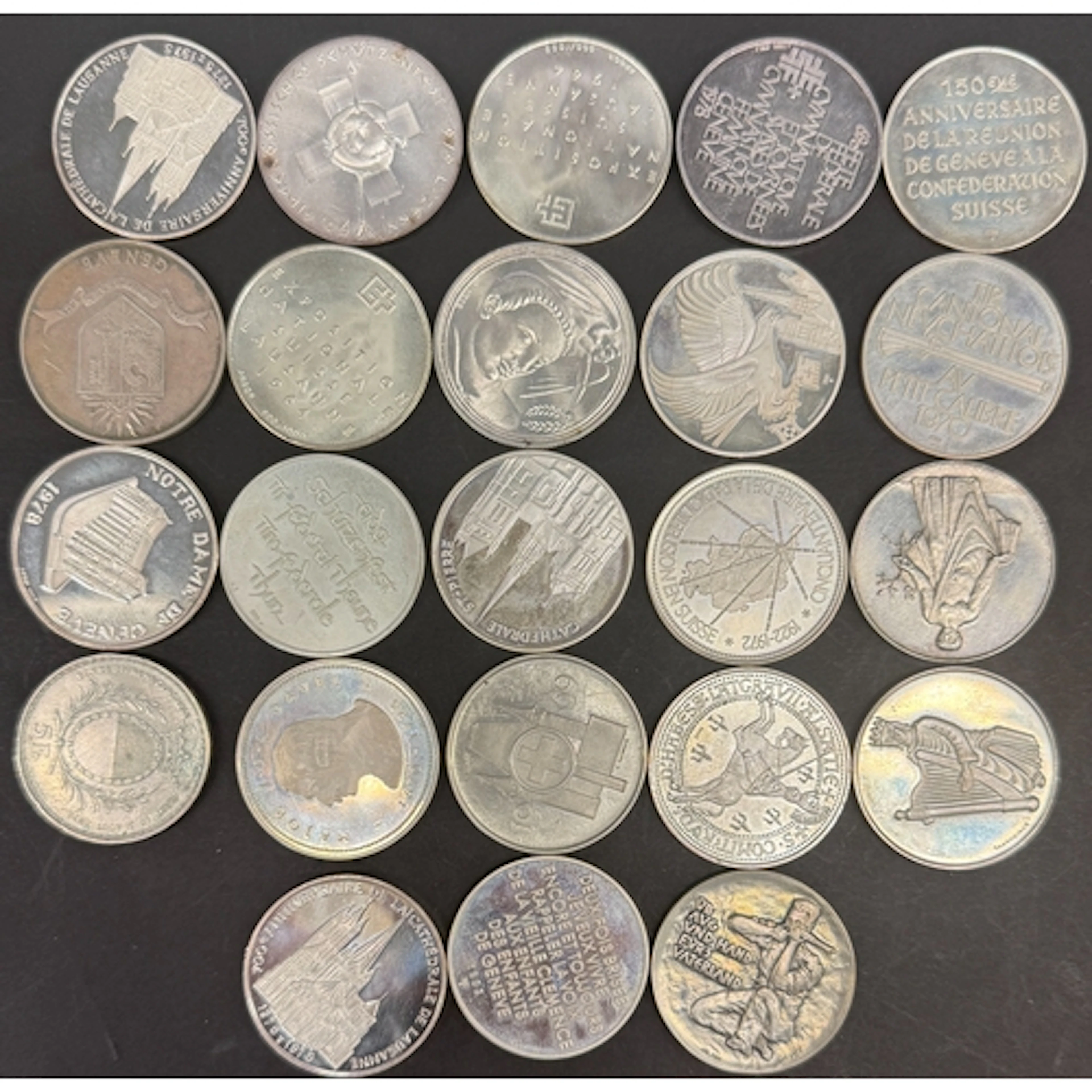 A collection of 23 Swiss .900 silver commemorative medals, m...