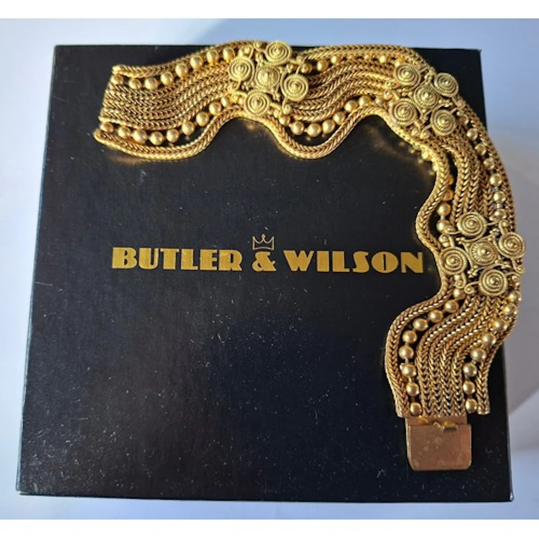 Butler & Wilson- A gold tone multi strand and articulated br...