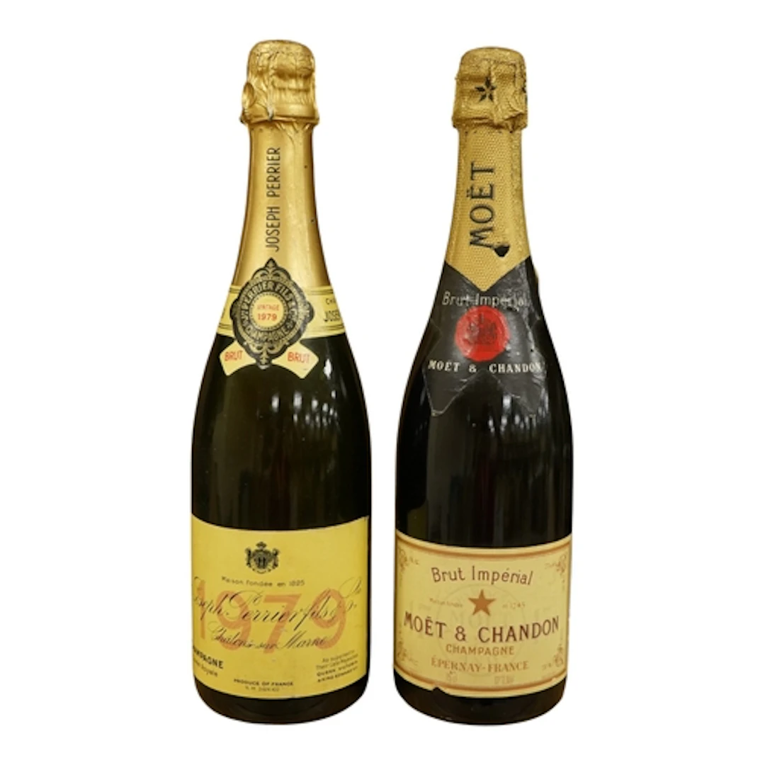 A bottle of Joseph Perrier 1979 vintage champagne and a bott...
