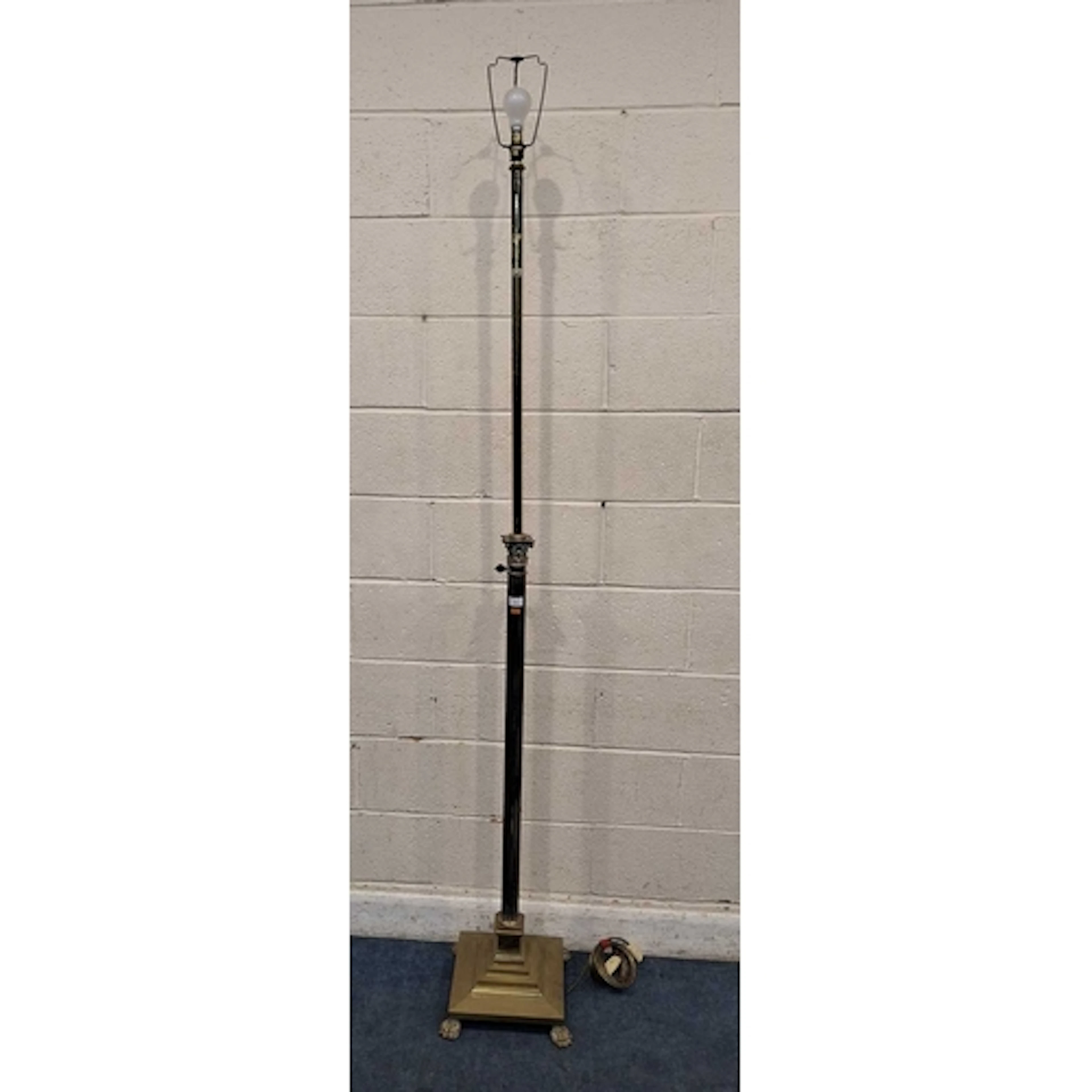 A BRASS TELESCOPIC STANDARD LAMP, with a corinthian style su...