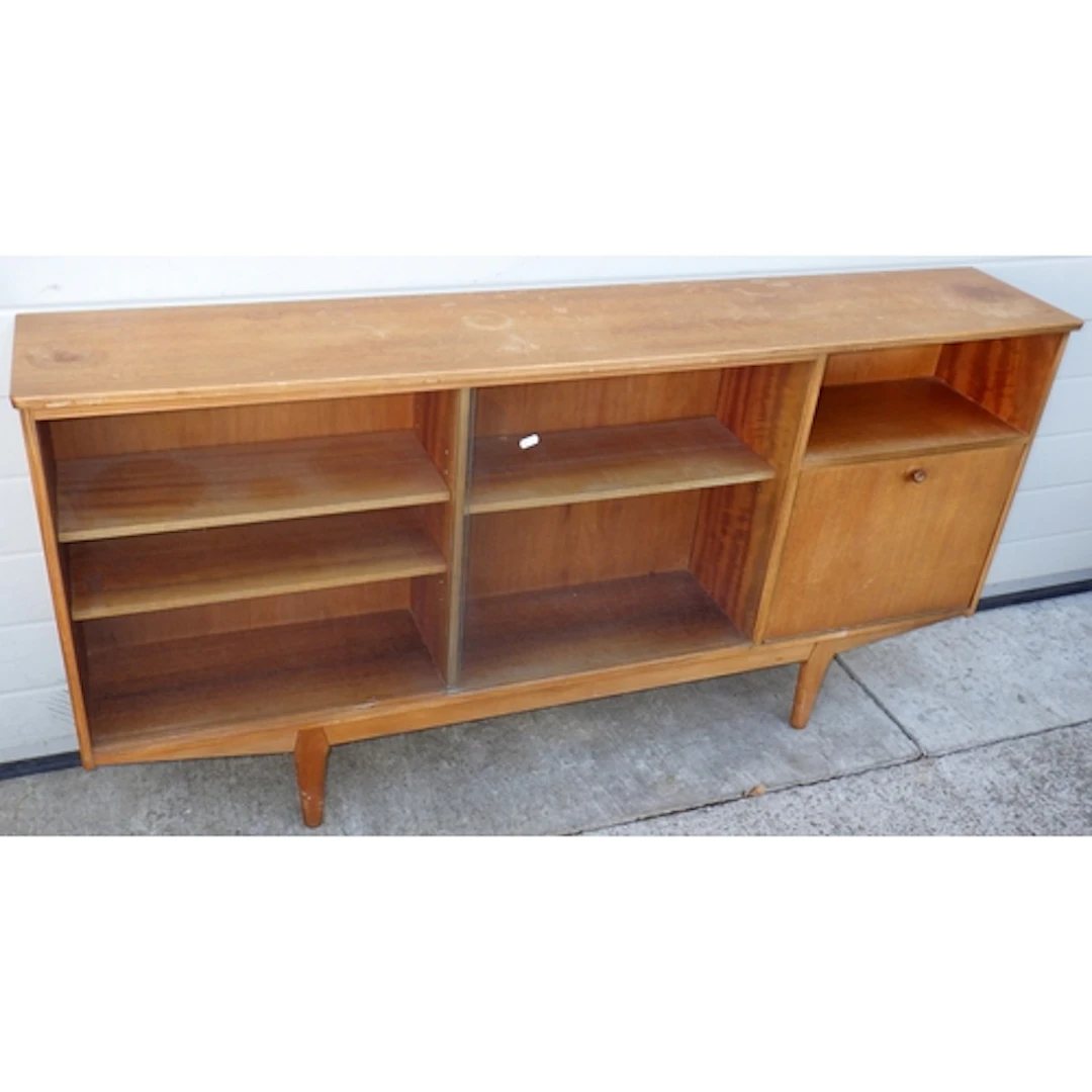A teak low bookcase with sliding glass doors, 153cm wide tog...