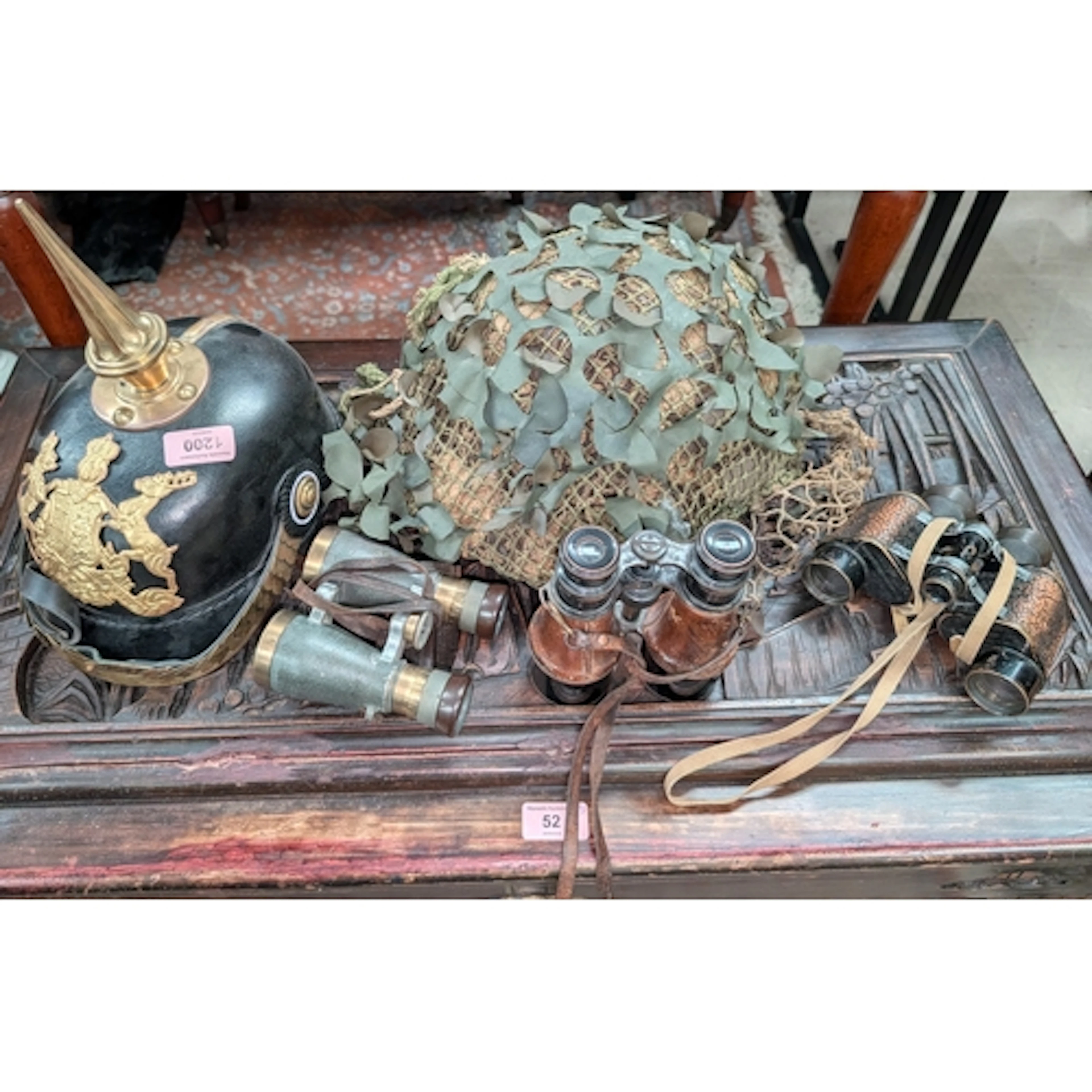 A vintage British military helmet with net and camouflage,&n...