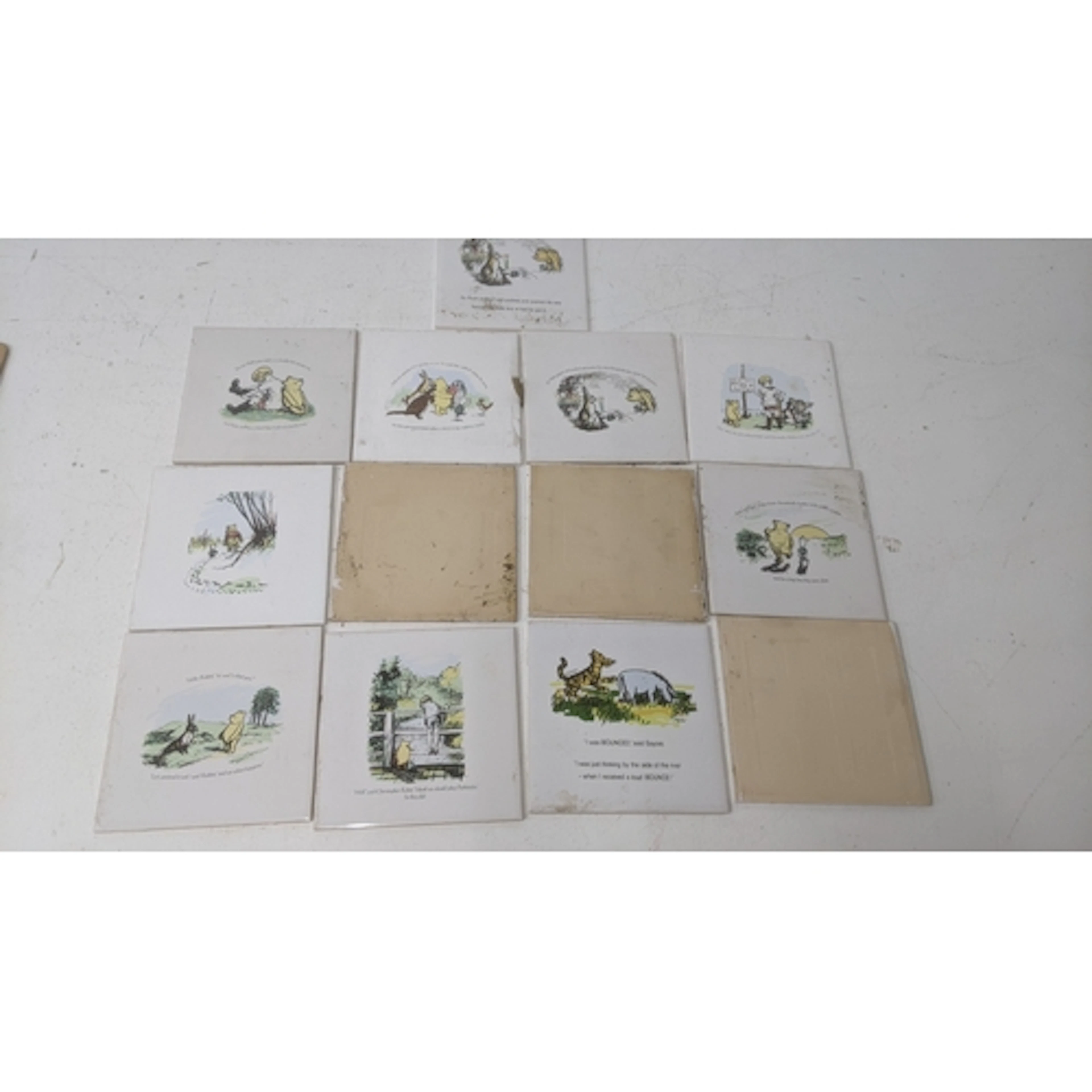 A large collection of Winnie the Pooh related porcelain tile...