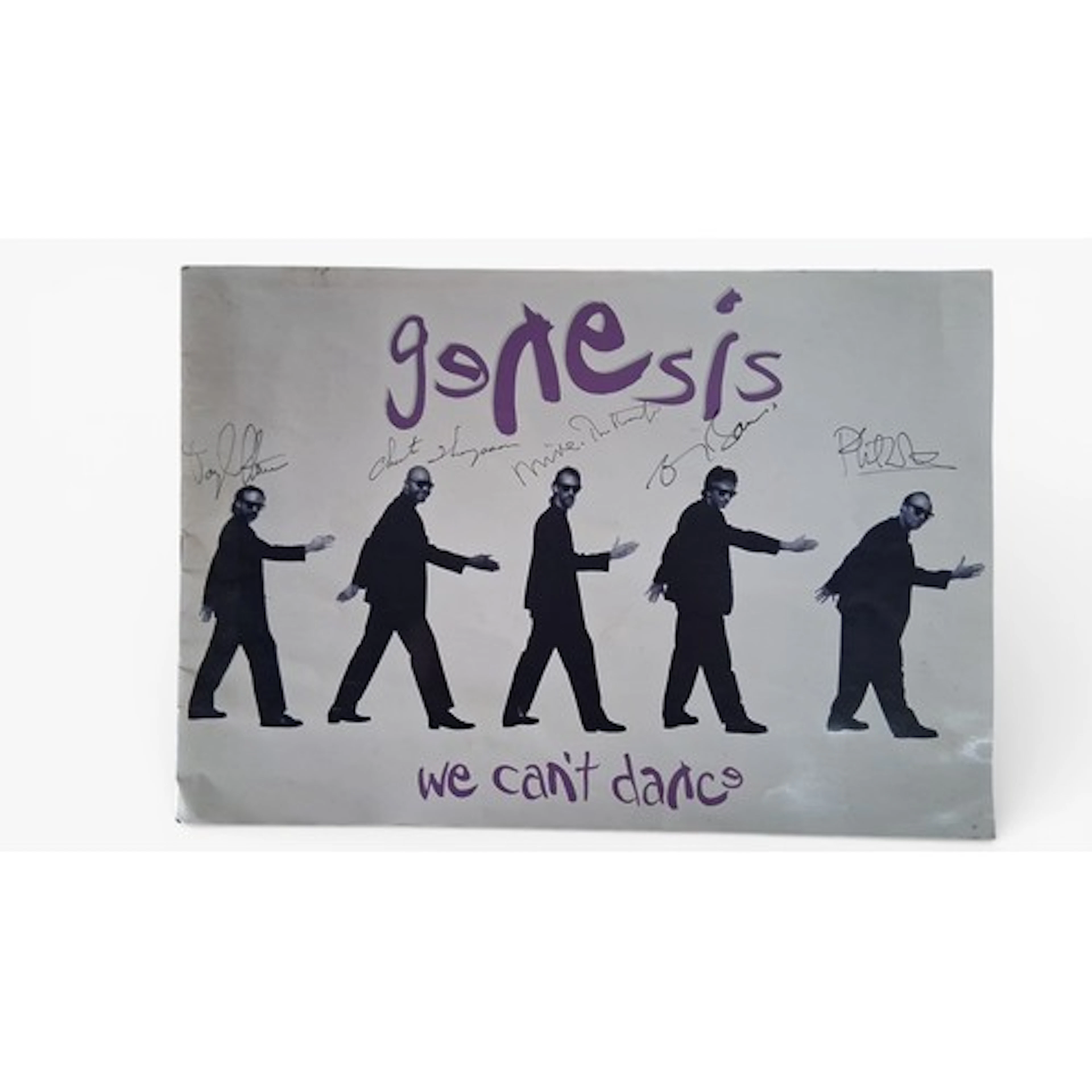 A group of music memorabilia, including signed Genesis tour ...