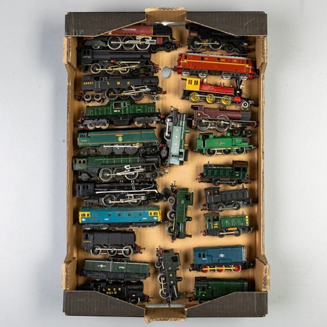 Fruit tray containing 00 gauge diesels and steam locos to in...