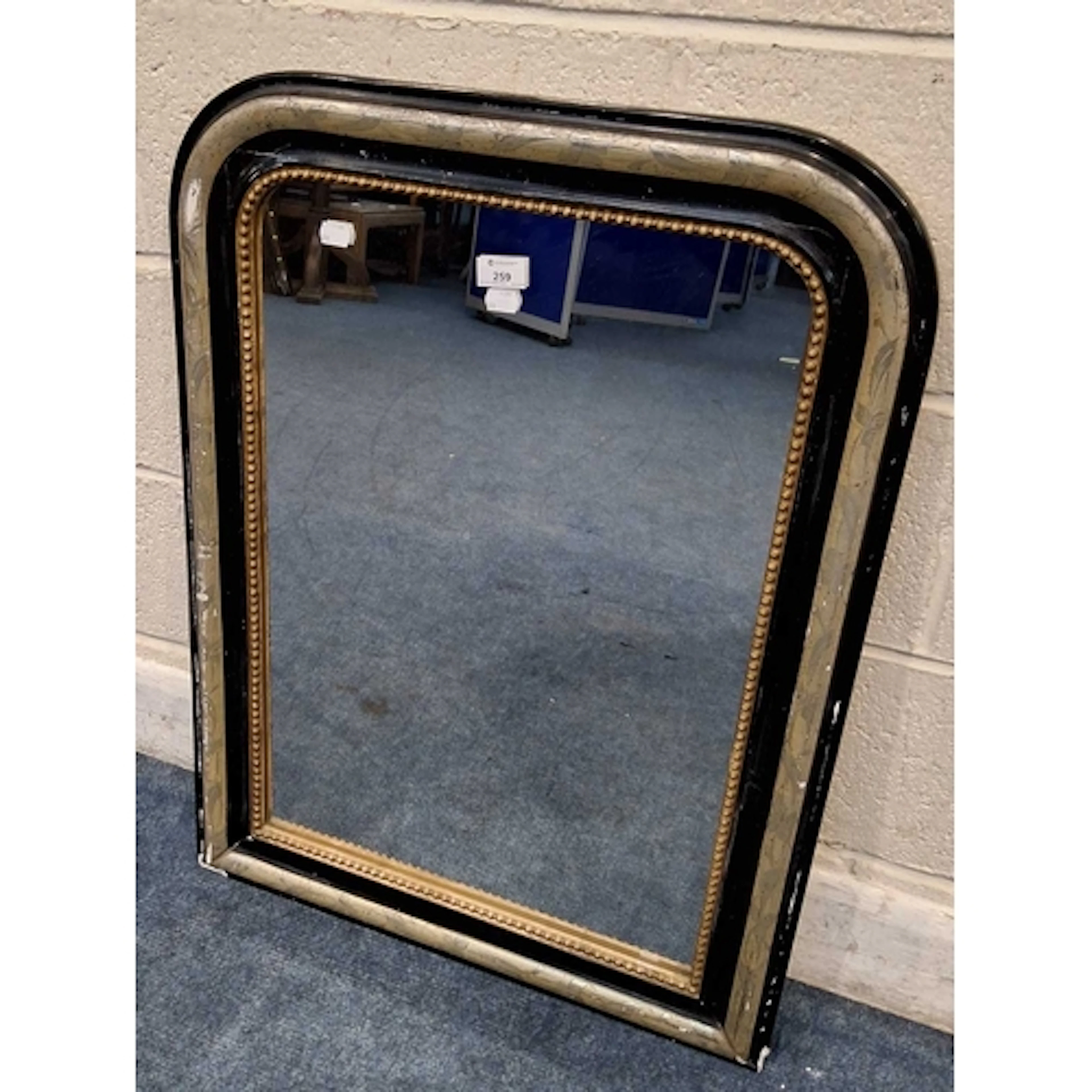 A VICTORIAN EBONISED AND FOLIATE WALL MIRROR (width 59cm x ...