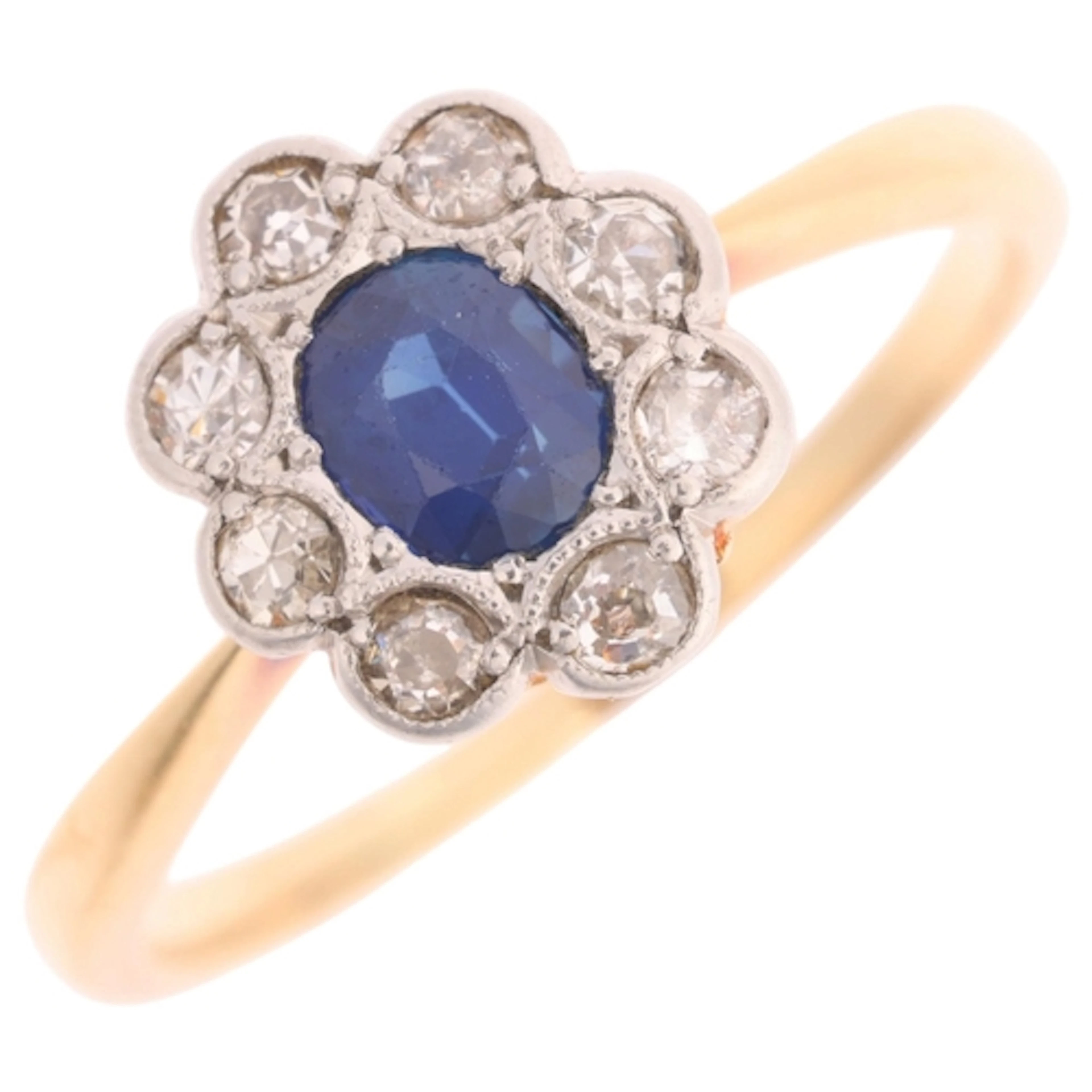 An 18ct gold sapphire and diamond cluster ring, set with 0.4...