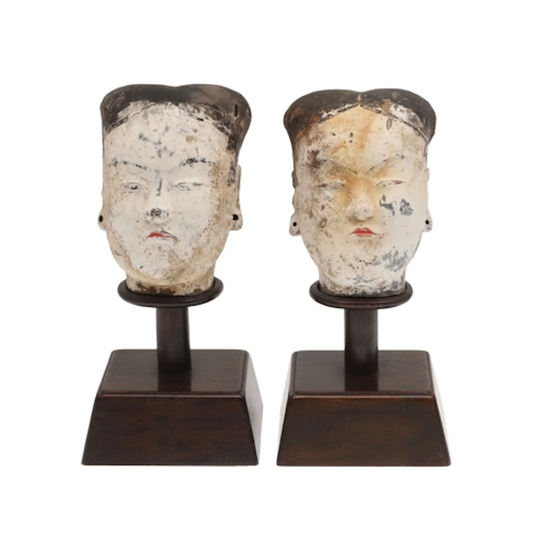 PAIR OF CHINESE POTTERY HEADS - HAN DYNASTY. Two painted pot...