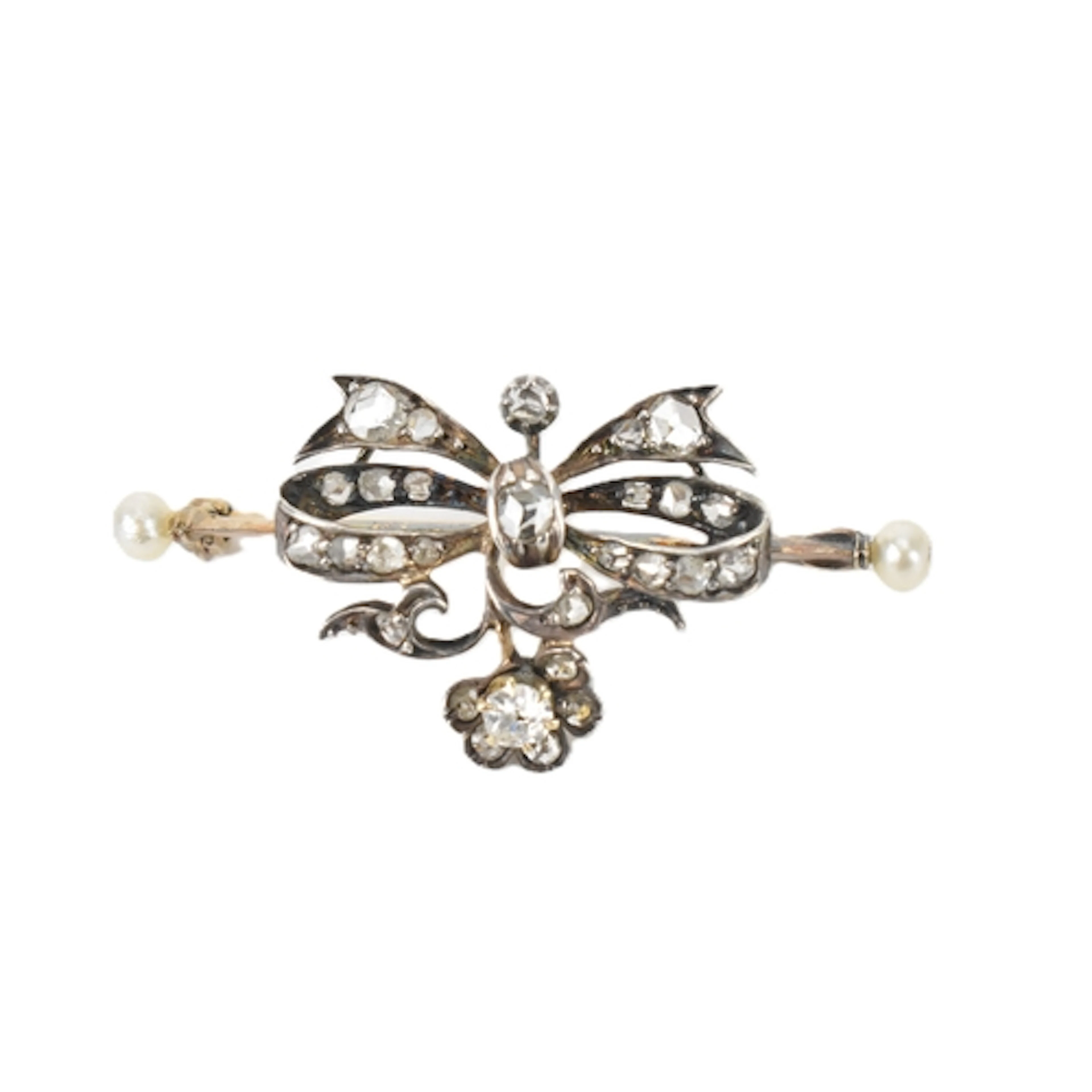 A late Victorian diamond and pearl ribbon bar brooch, unmark...
