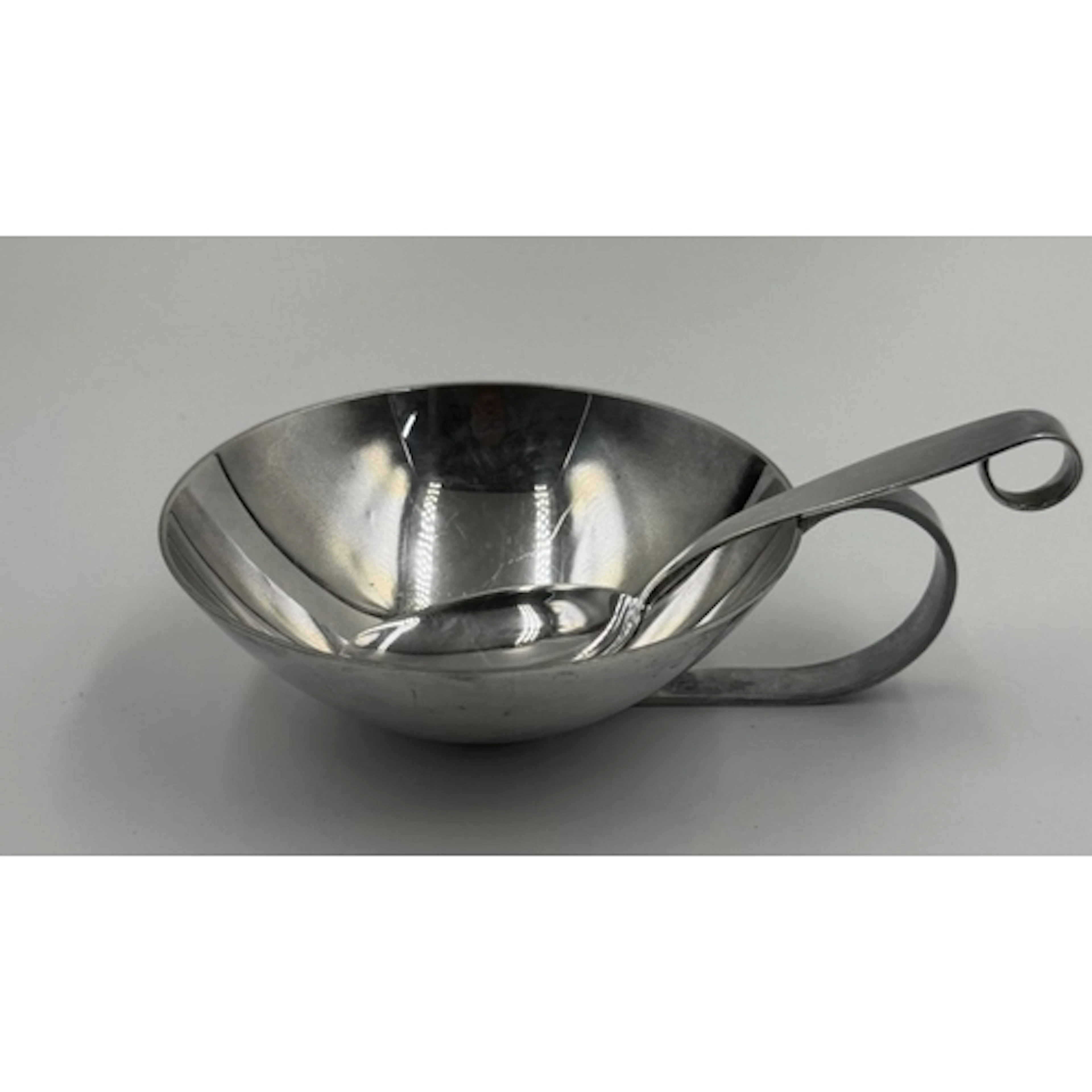 A Swedish designed sauce boat and spoon