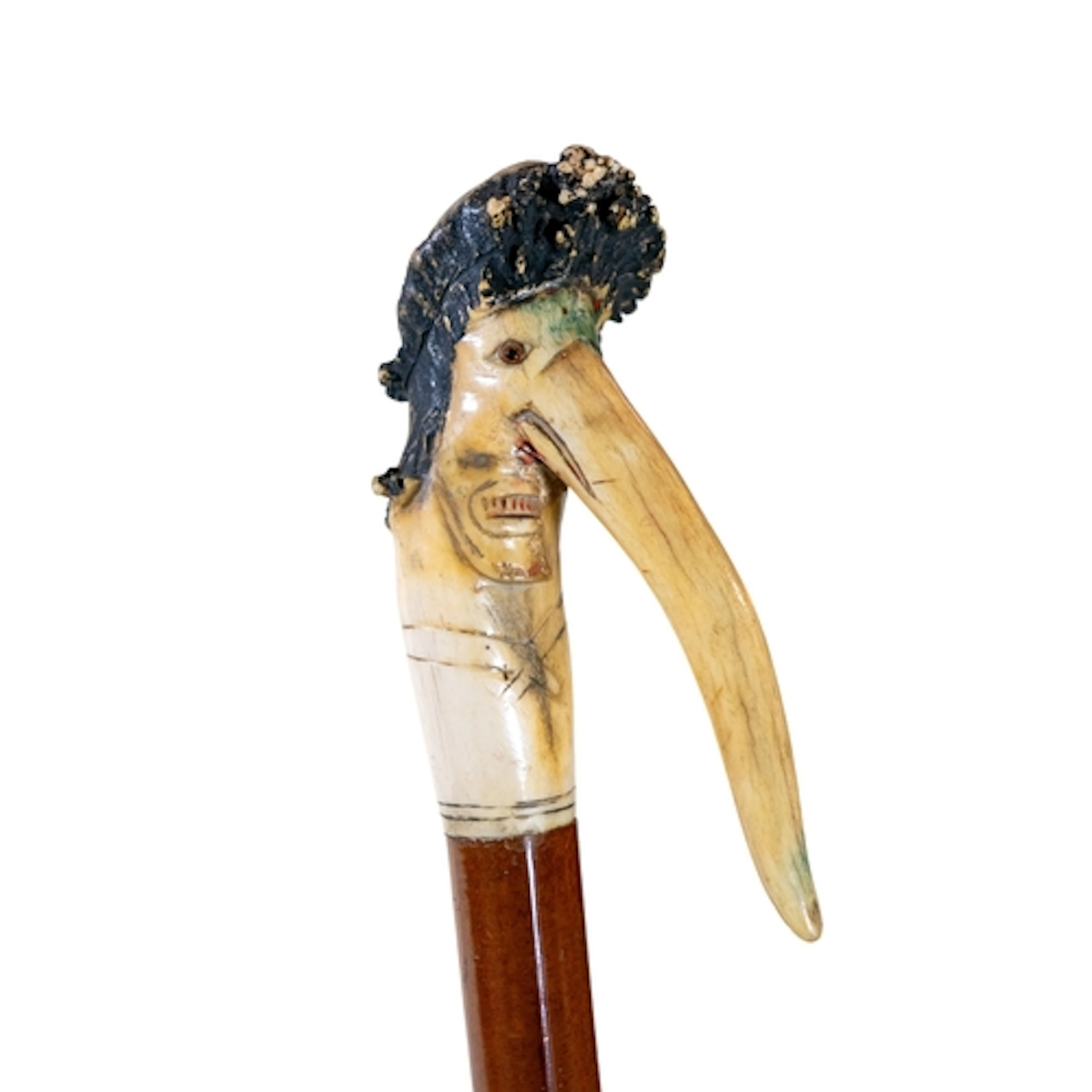A Victorian carved stag antler figural walking cane, carved ...