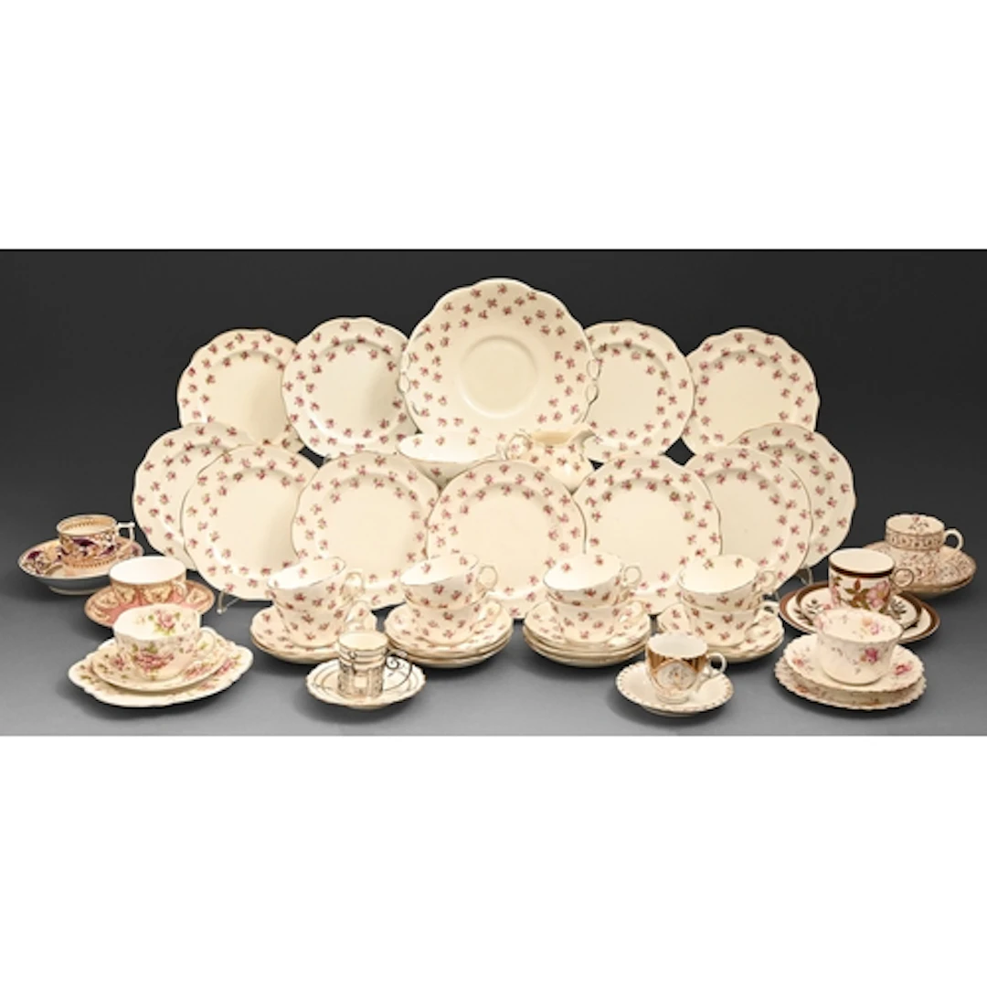 An Aynsley bone china coffee cup and saucer with pierced sil...