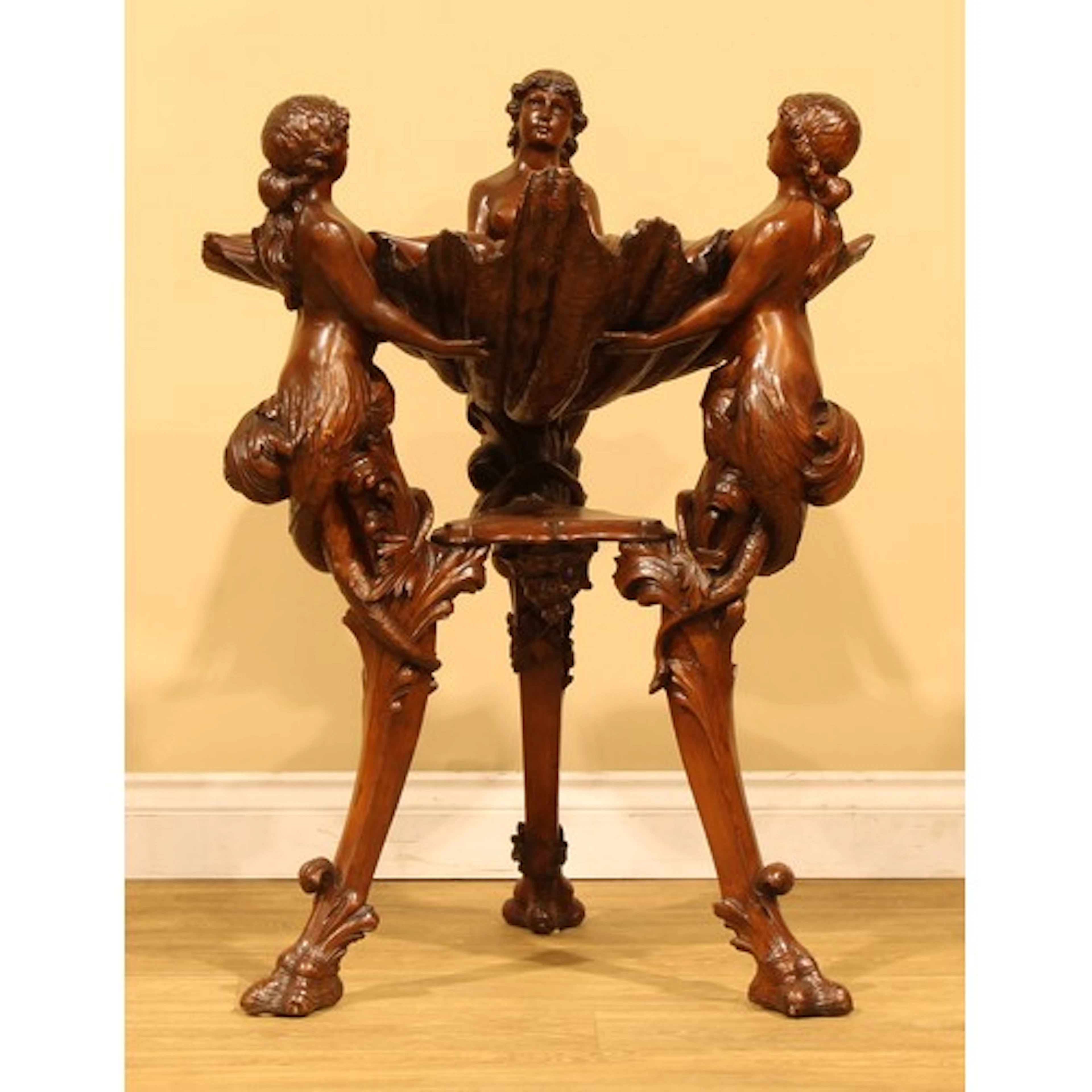 An Italian softwood room centre figure group, in the manner ...