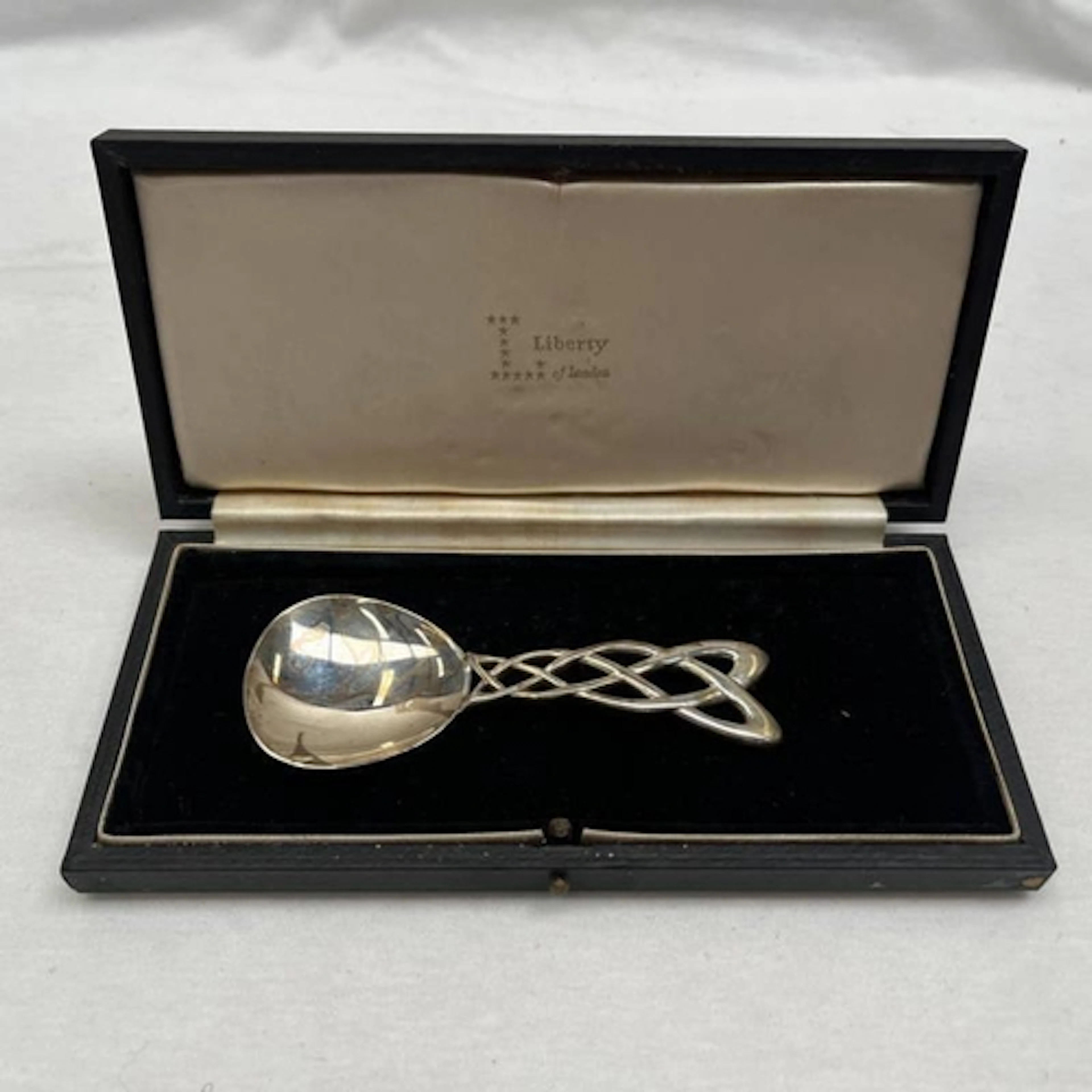 AN ARTS & CRAFTS STYLE MODERN SILVER CADDY SPOON WITH CELTIC...