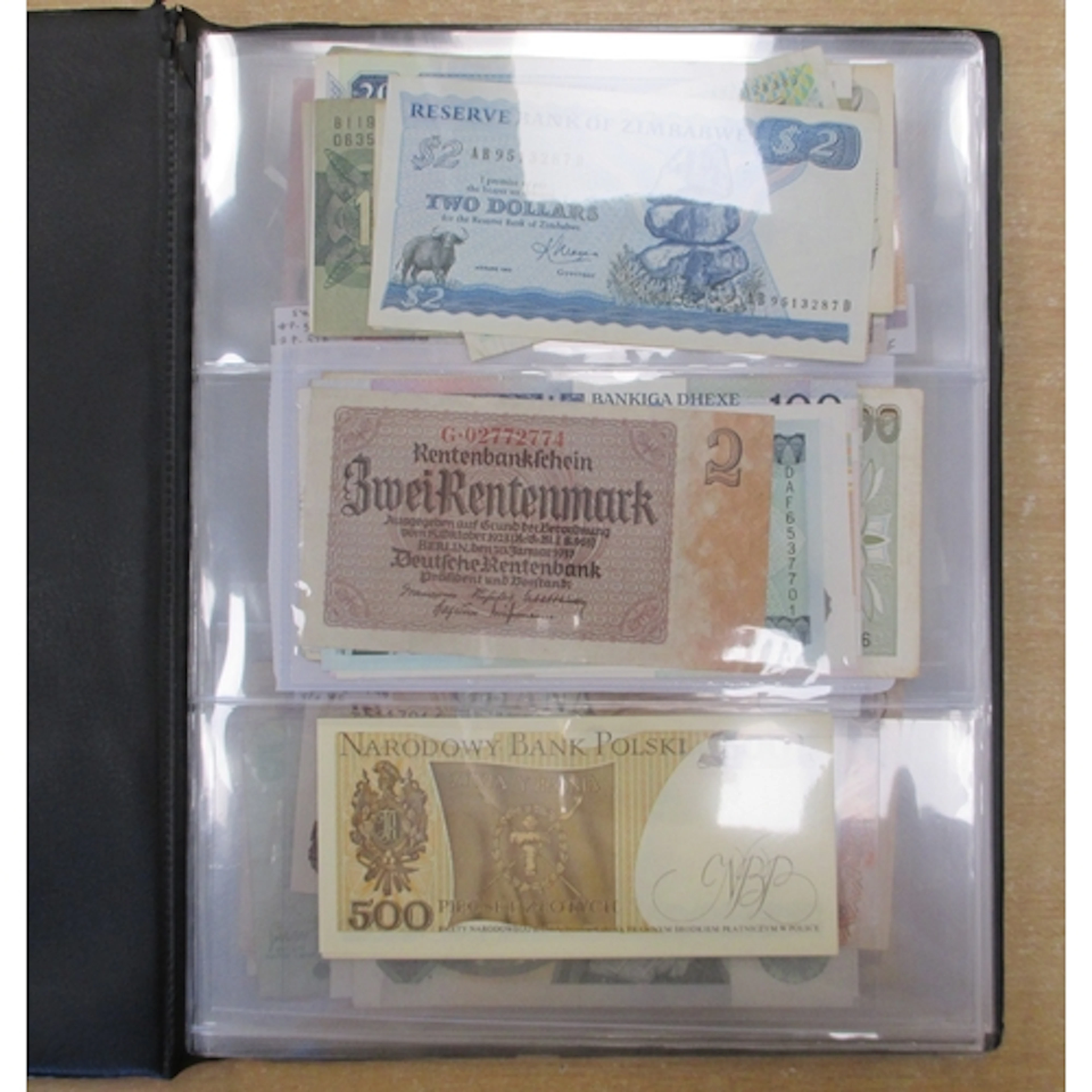 Collection of world banknotes in an album generally fine to ...