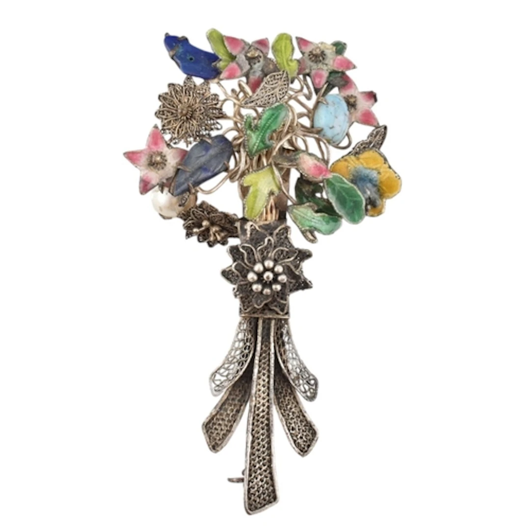 A Chinese white metal and coloured enamel flower spray bouqu...