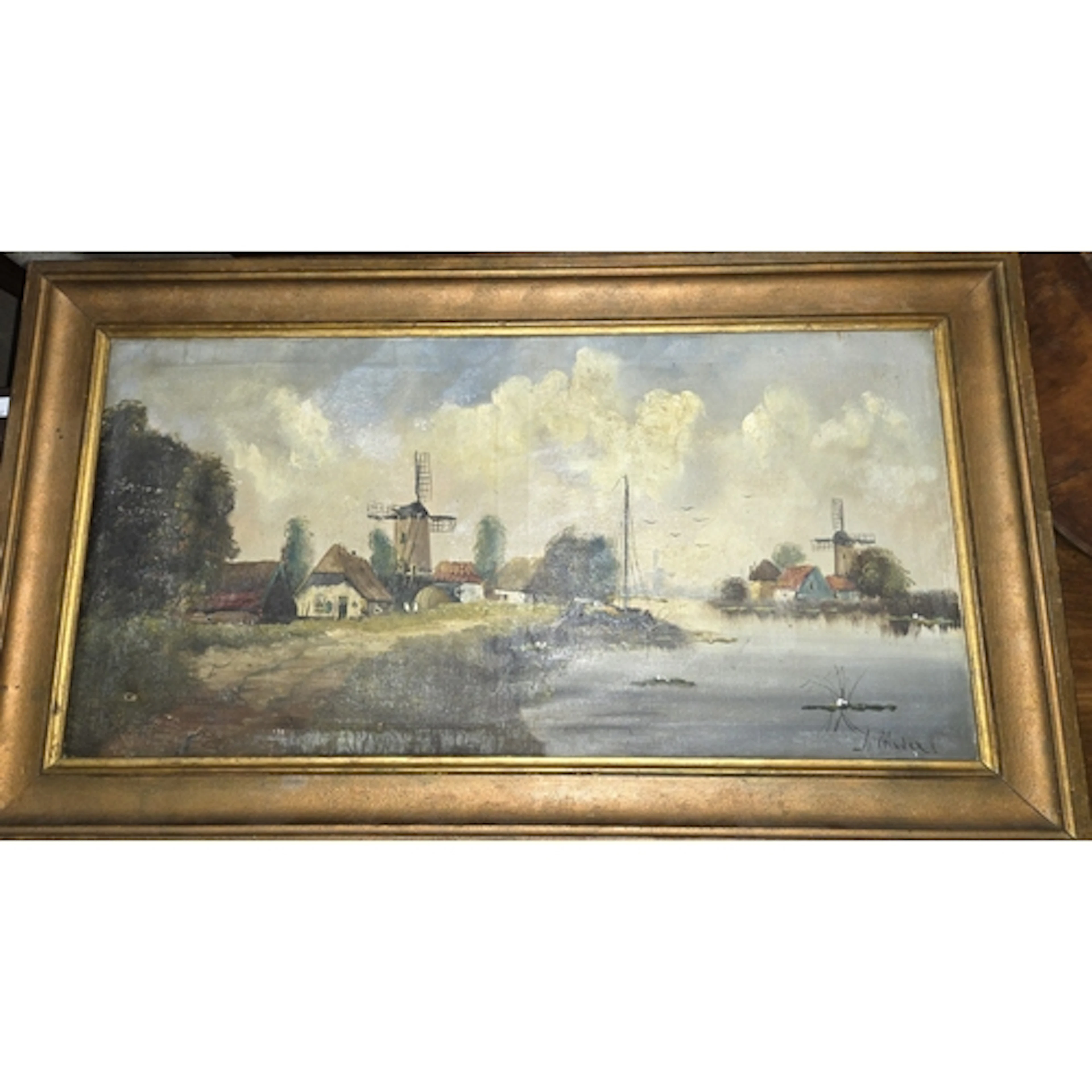 An early 20th century Dutch oil painting, with windmills by ...